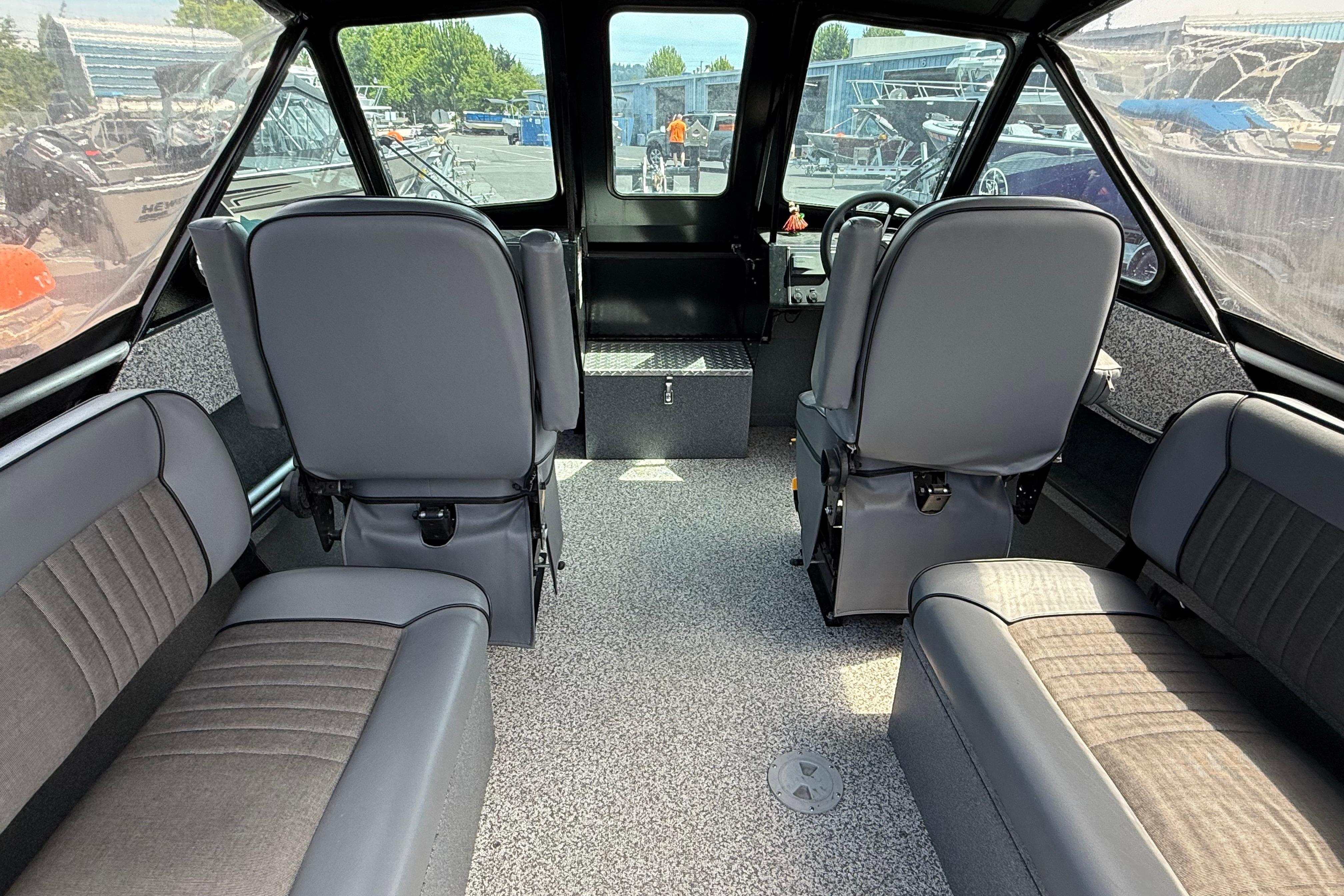 2019 Alumaweld Intruder Hard Top 22' boat interior with gray seating and spacious layout.