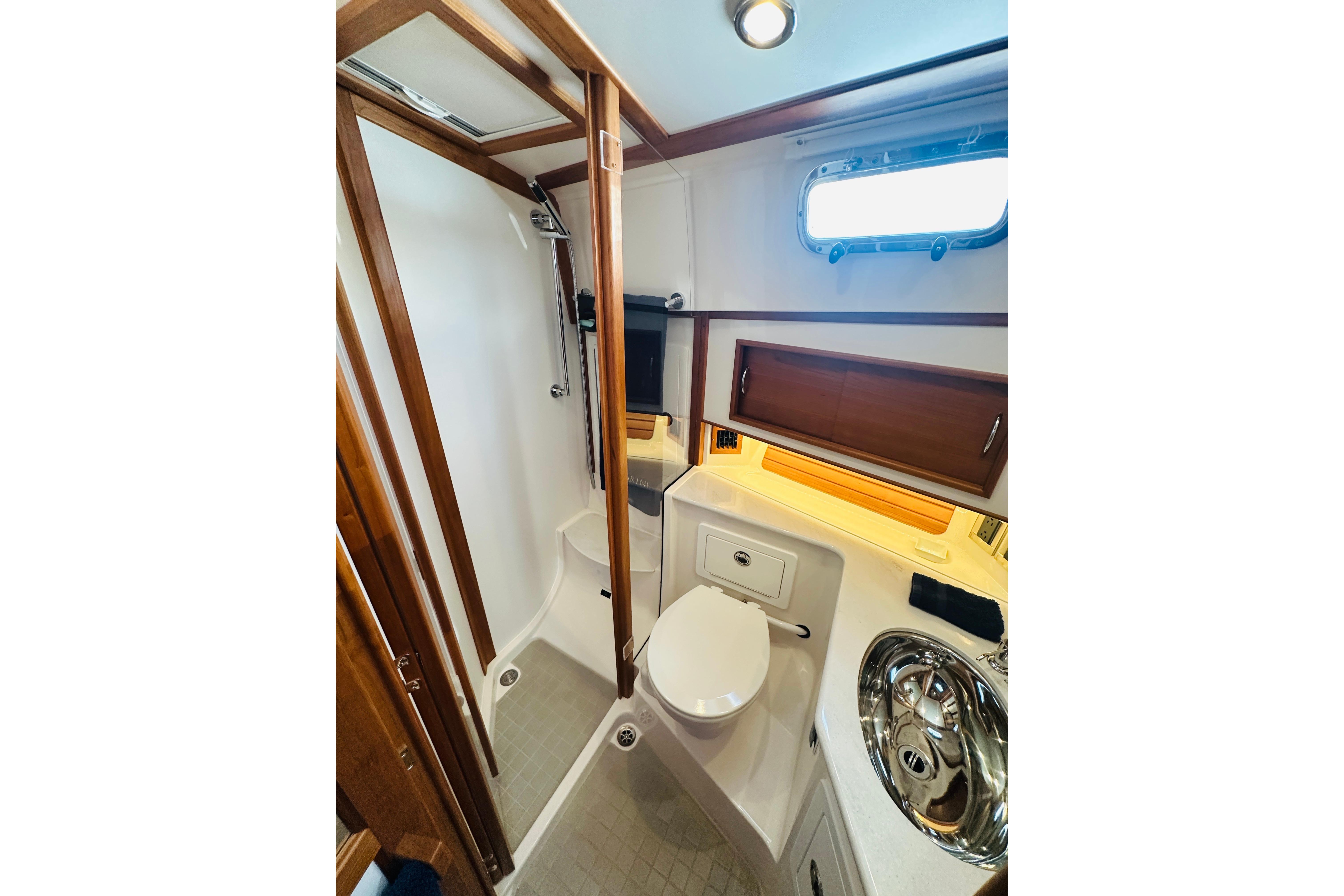 Luxurious bathroom interior of 2025 Sabre 48 Salon Express yacht, featuring modern fixtures.