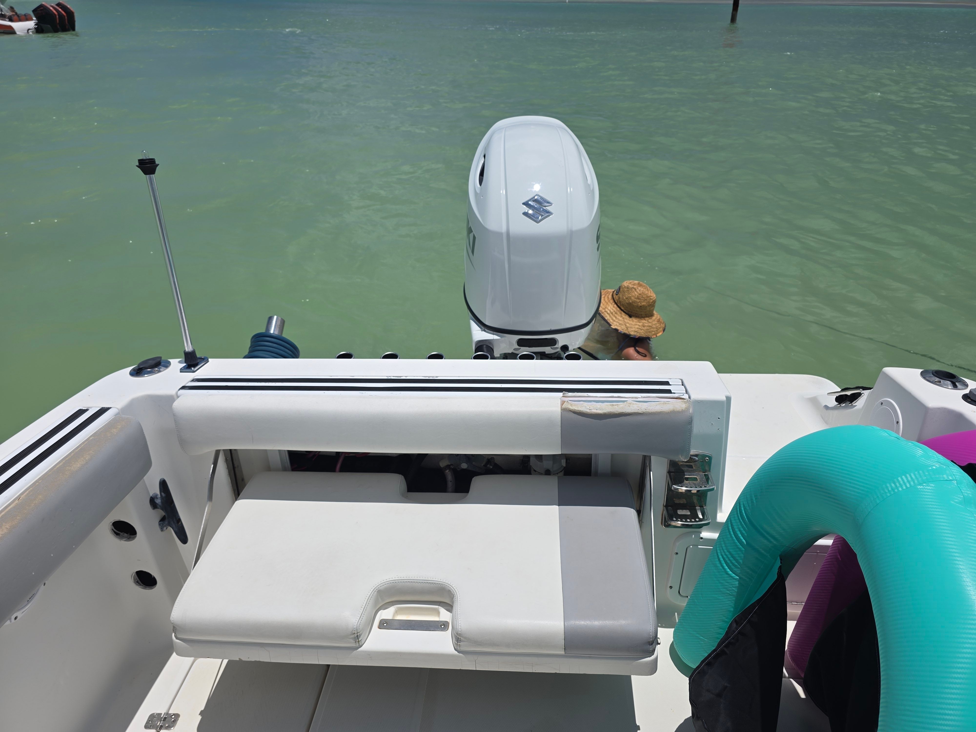 Wellcraft Sportsman 2001 boat on calm water with outboard motor.