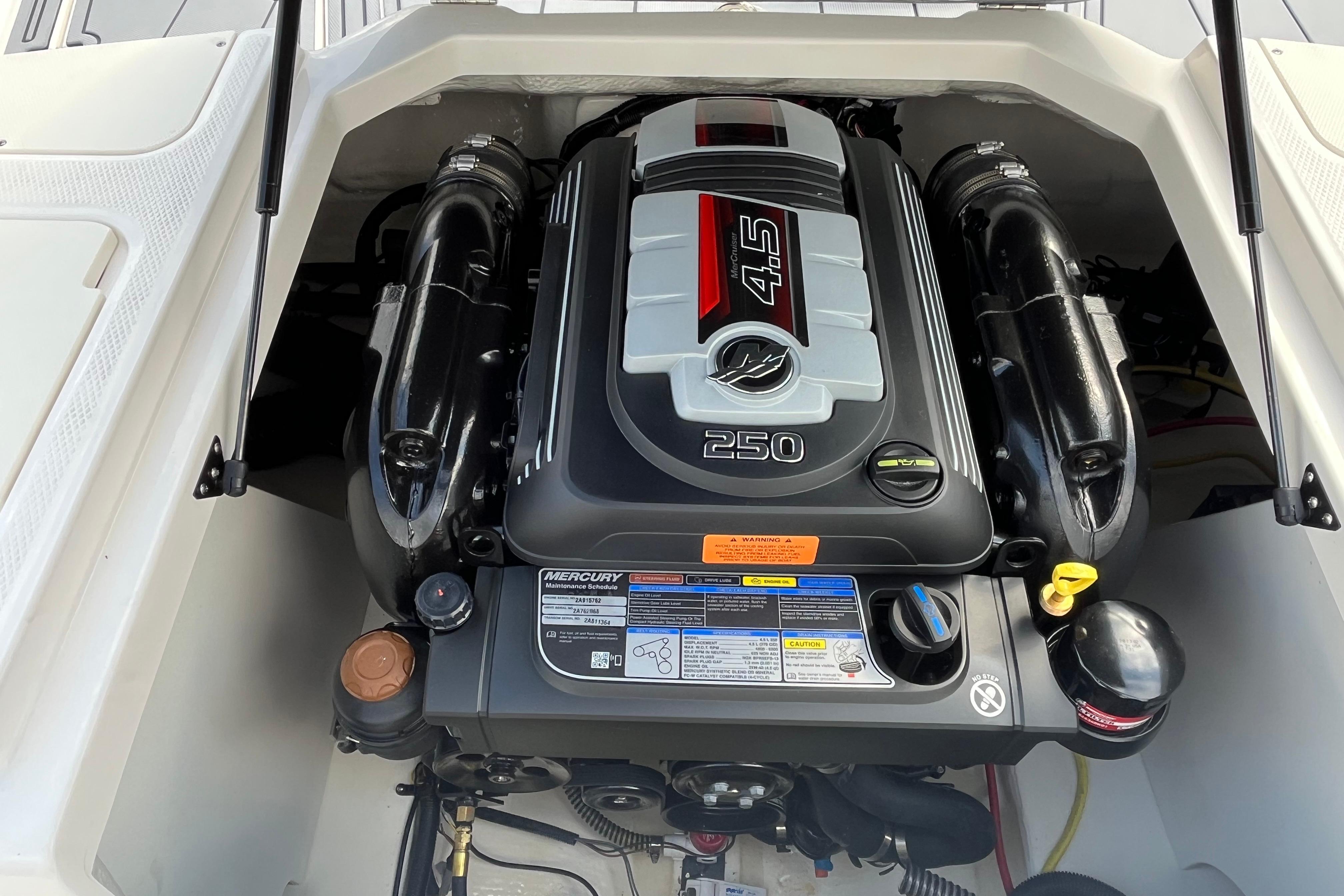 Engine compartment of 2026 Chaparral 21 SSi boat, featuring a powerful 4.5L 250 HP engine.