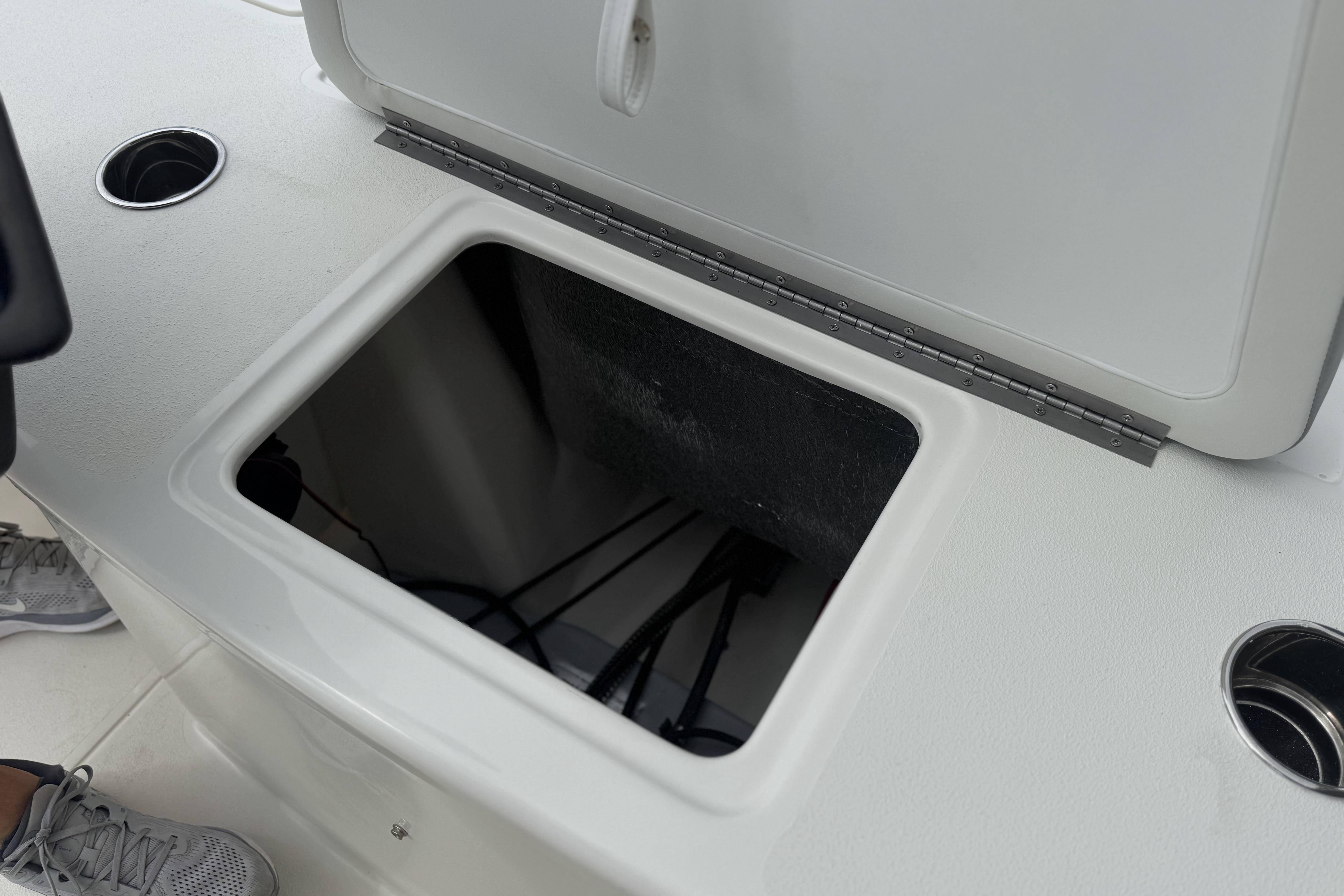 Open storage compartment on 2026 Mako 18 Pro Skiff boat deck.