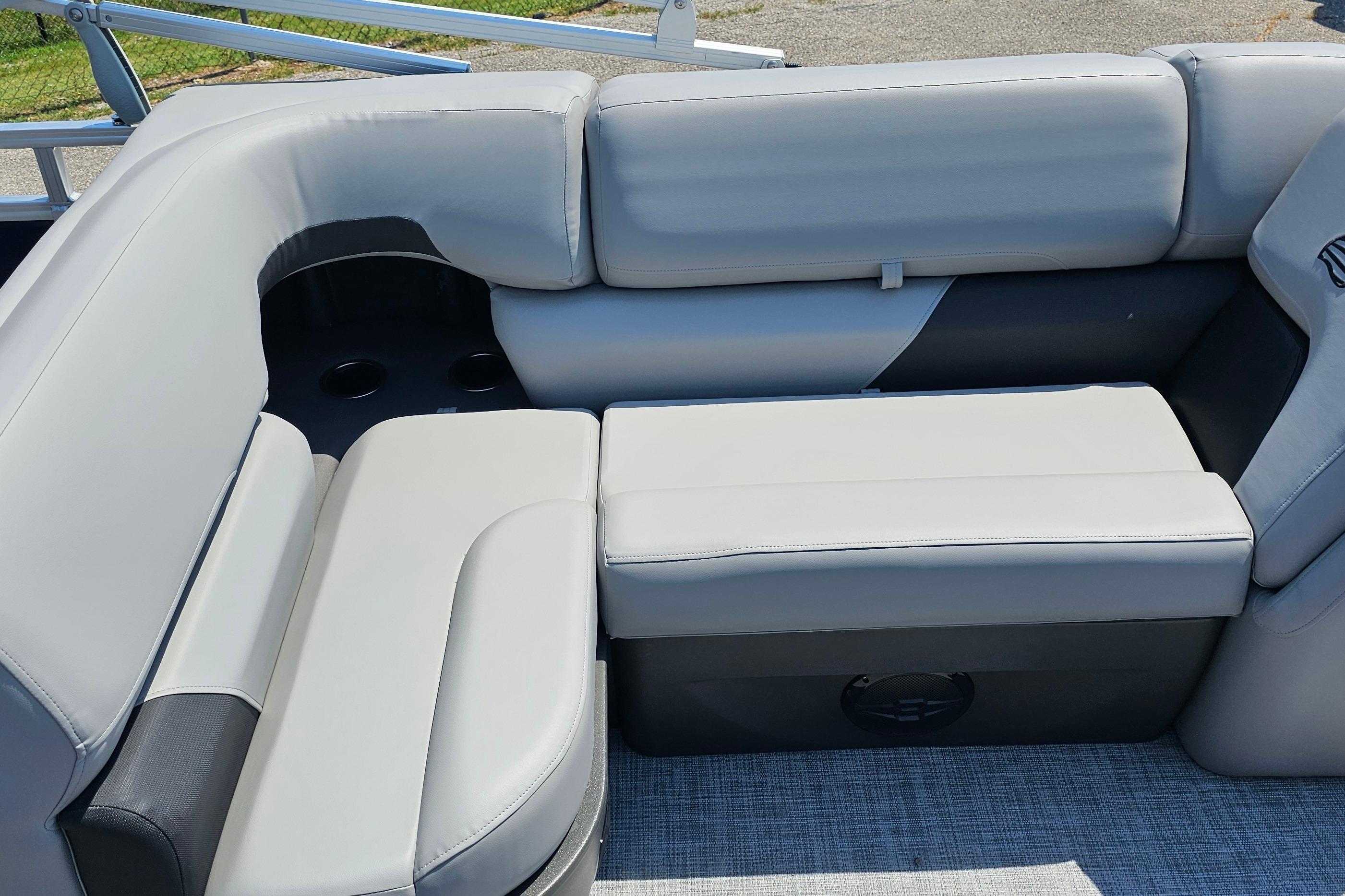 2026 Sun Tracker SportFish 20 DLX boat with comfortable gray seating and cup holders.
