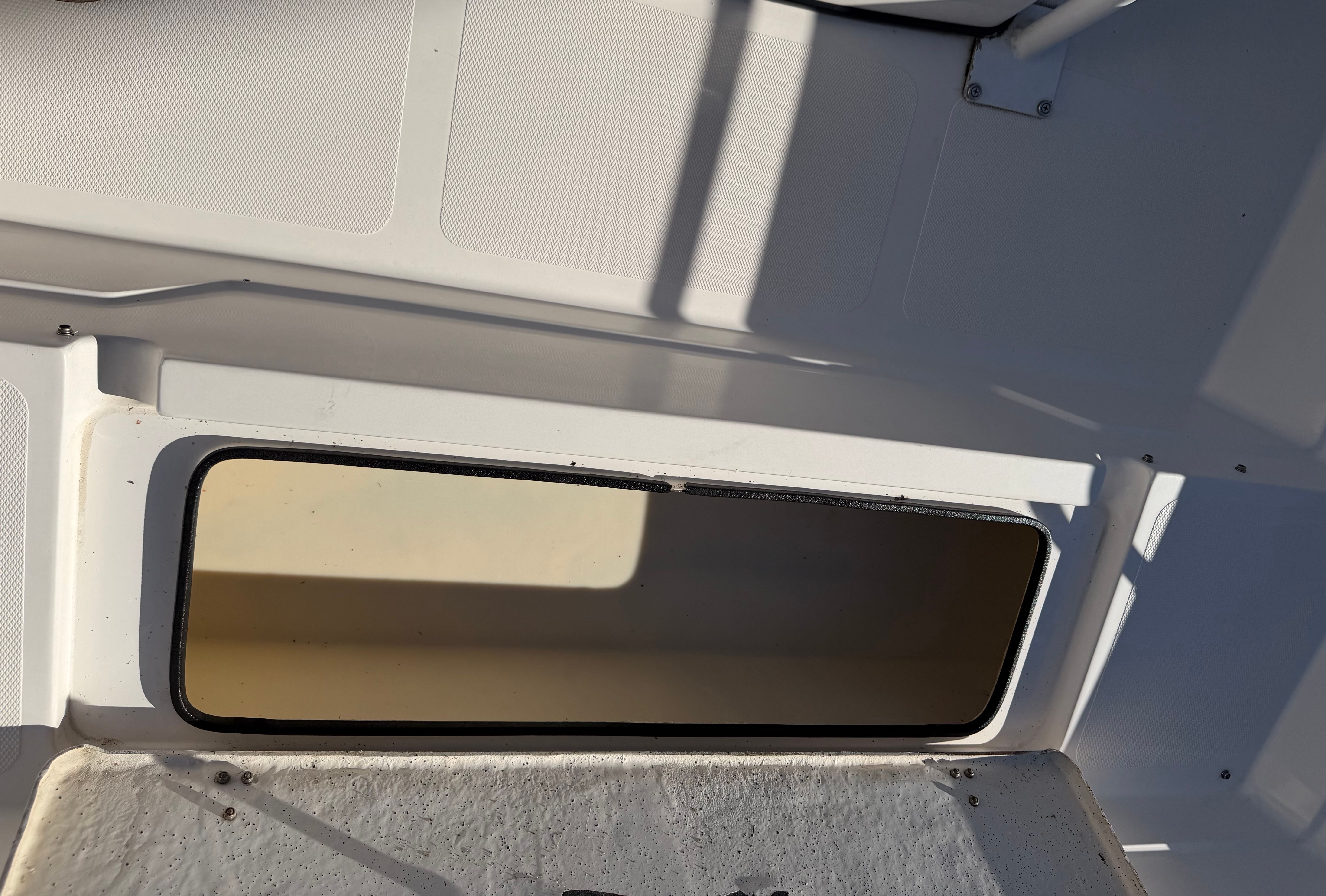 Interior of a 1999 Skeeter ZX2200 boat, white surface.