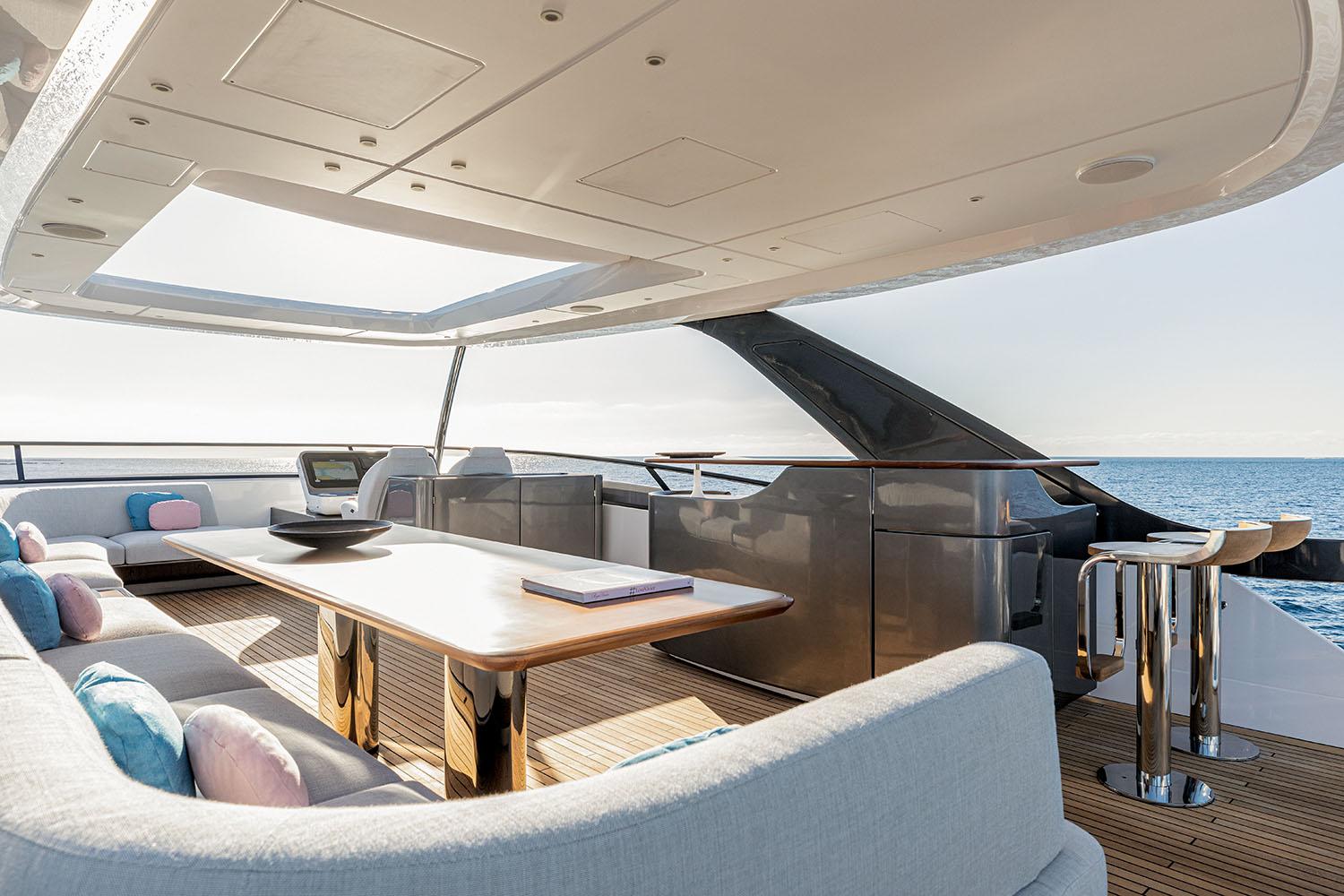 Luxurious Azimut Grande 26M yacht deck, 2025 model, featuring elegant seating and ocean views.