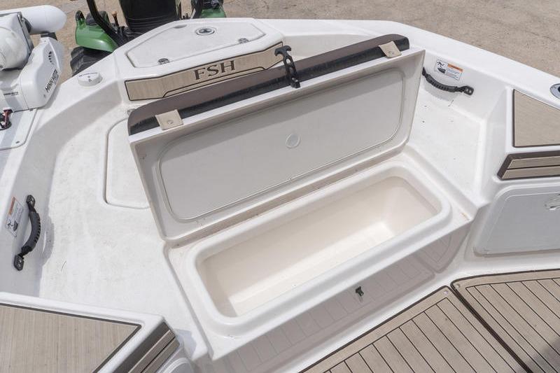 2023 Yamaha Boats 195 FSH Sport storage compartment, open on deck, showcasing spacious interior.