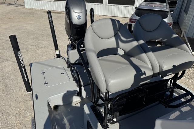 2025 Majek 24 Reaper boat with dual seats and Suzuki outboard motor.