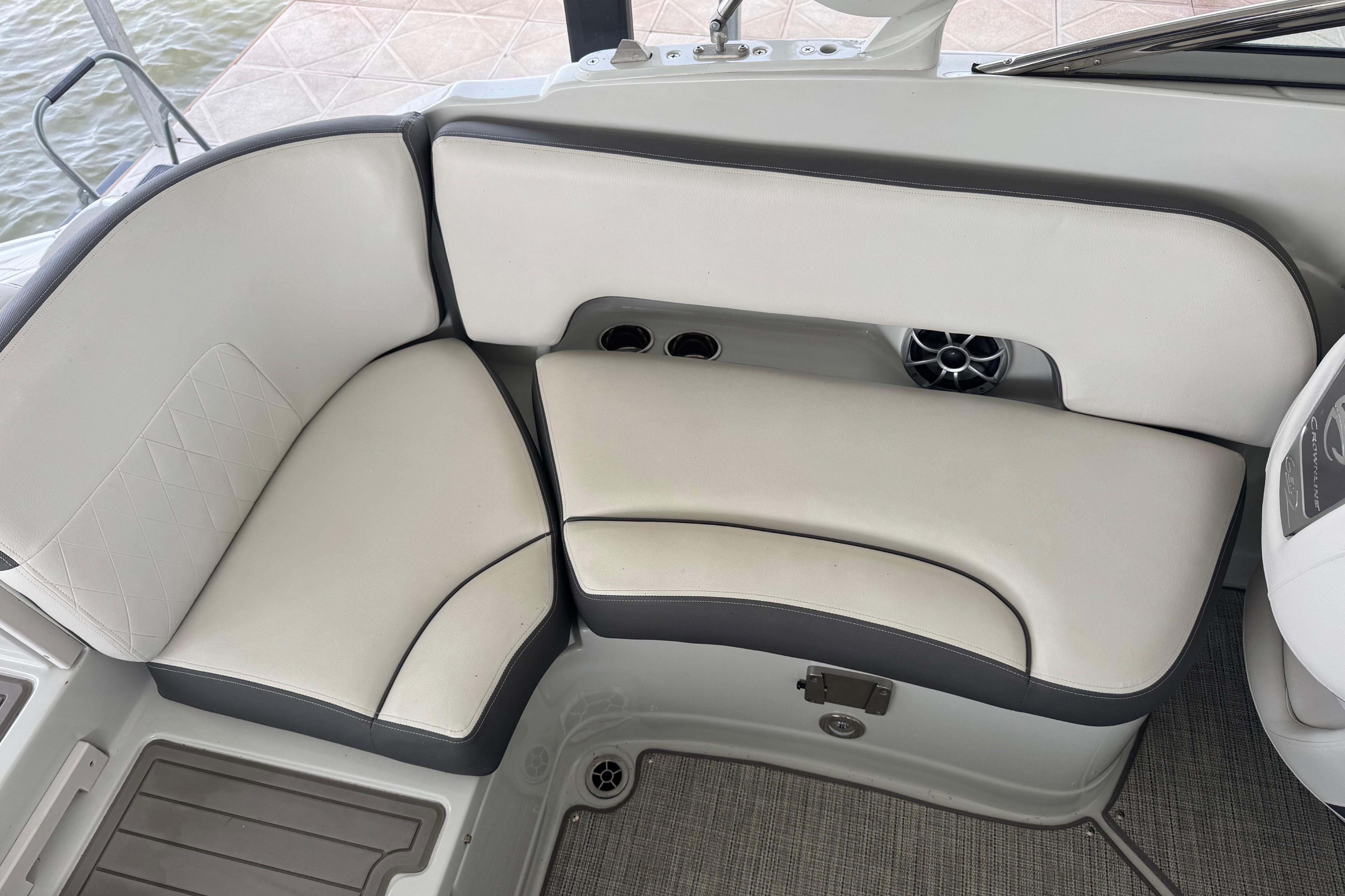 2022 Crownline 265 SS boat interior with cushioned seating and cup holders.