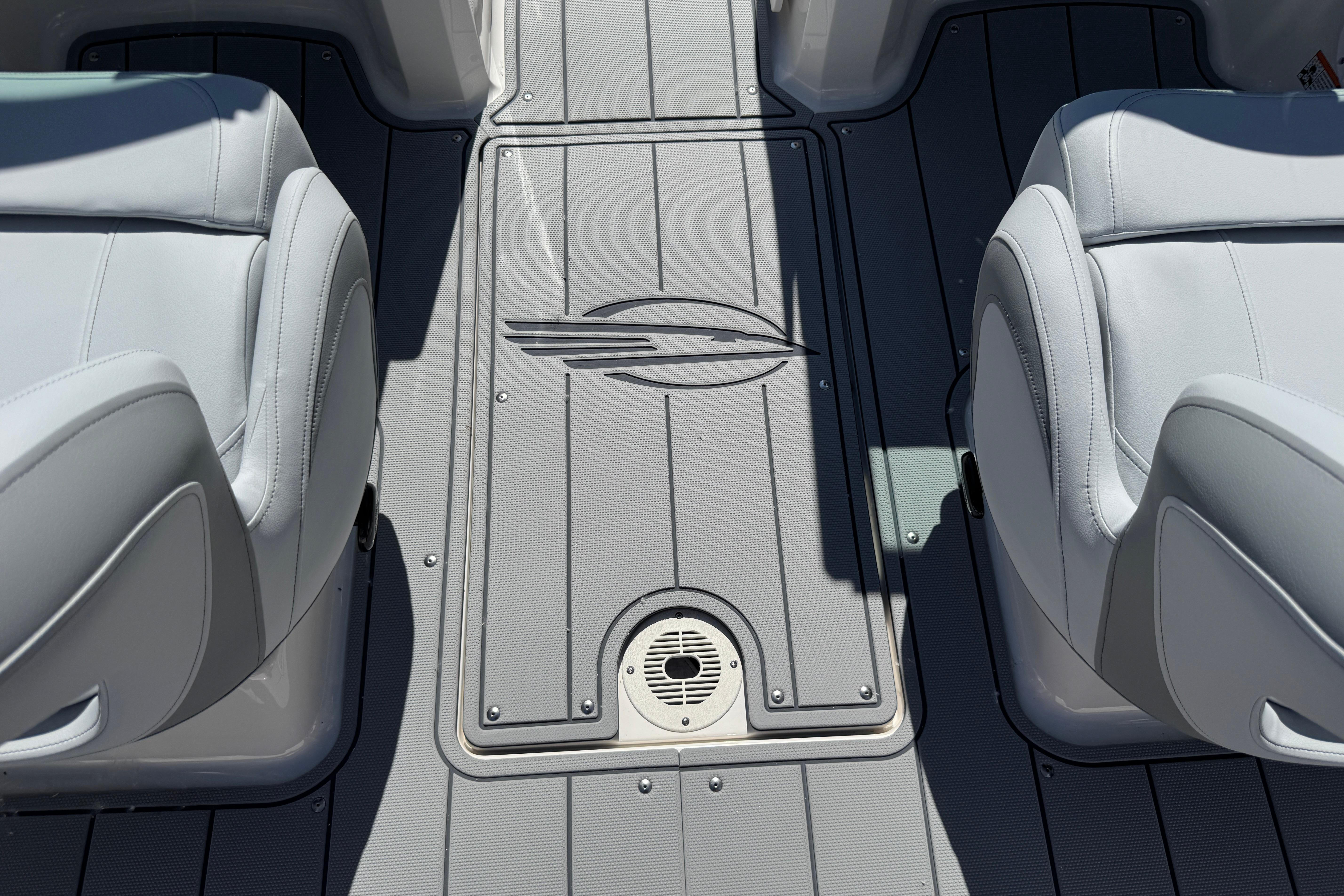 Interior view of 2026 Chaparral 21 SSi boat, featuring sleek seating and deck design.