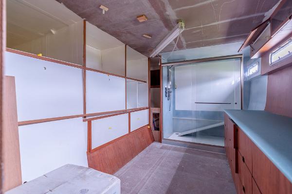 Interior of 2025 Catamaran Bloomfield 86 Motorsailor, featuring modern cabinetry and spacious layout.