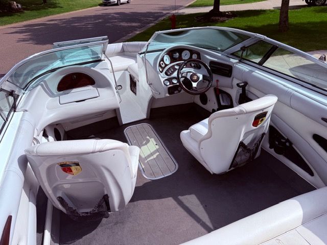 Interior of a 2001 Mariah Shabah with white seats and a modern dashboard.