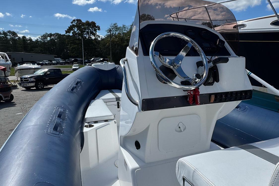 2020 AB Inflatables Oceanus 21 VST boat with steering console and blue inflatable sides.
