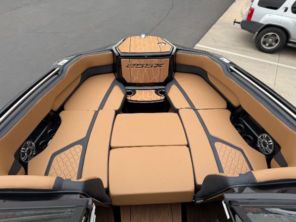 2025 Yamaha Boats 255XD interior with tan seating and sleek design.