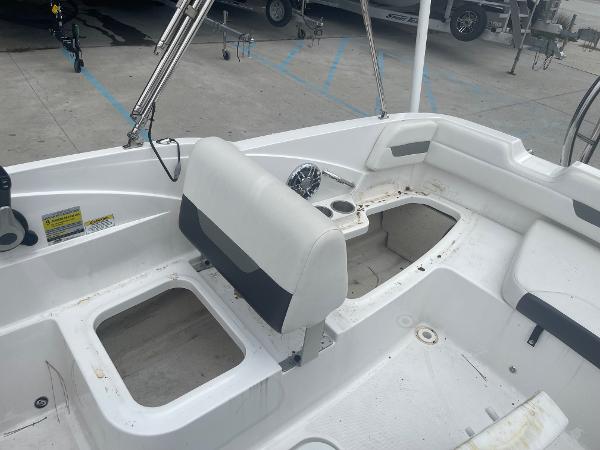 2022 Hurricane SS185 OB boat interior with white seating and storage compartments.
