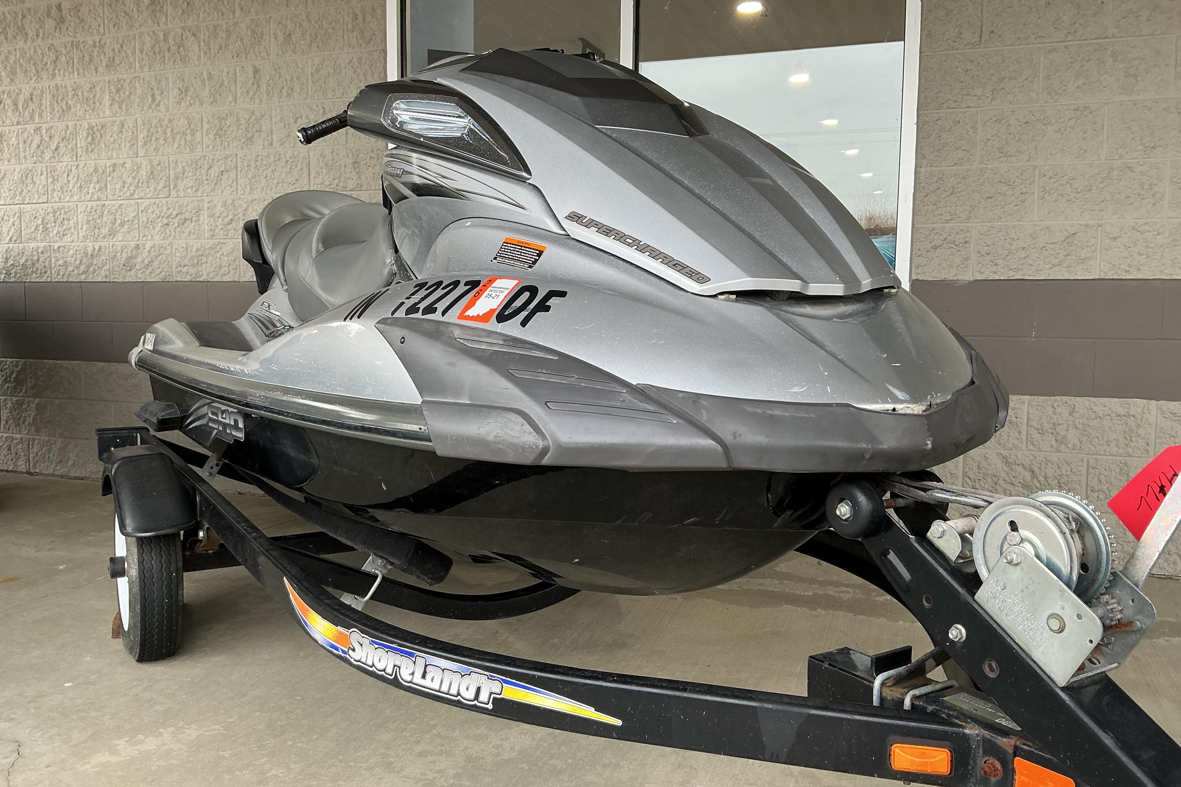 2008 Yamaha WaveRunner FX Cruiser SHO on trailer, parked outside a building.