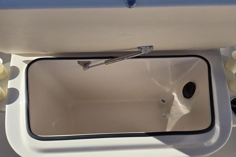 Open storage compartment on 2026 Grady-White Fisherman 180 boat.
