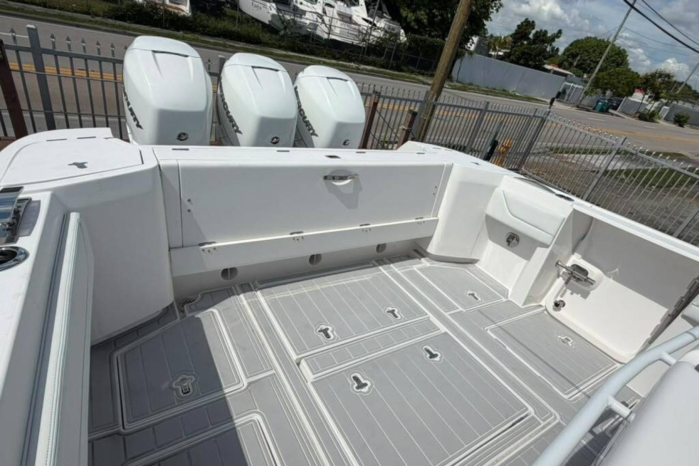 2020 Intrepid 375 Nomad SE boat deck with triple Mercury outboard engines.