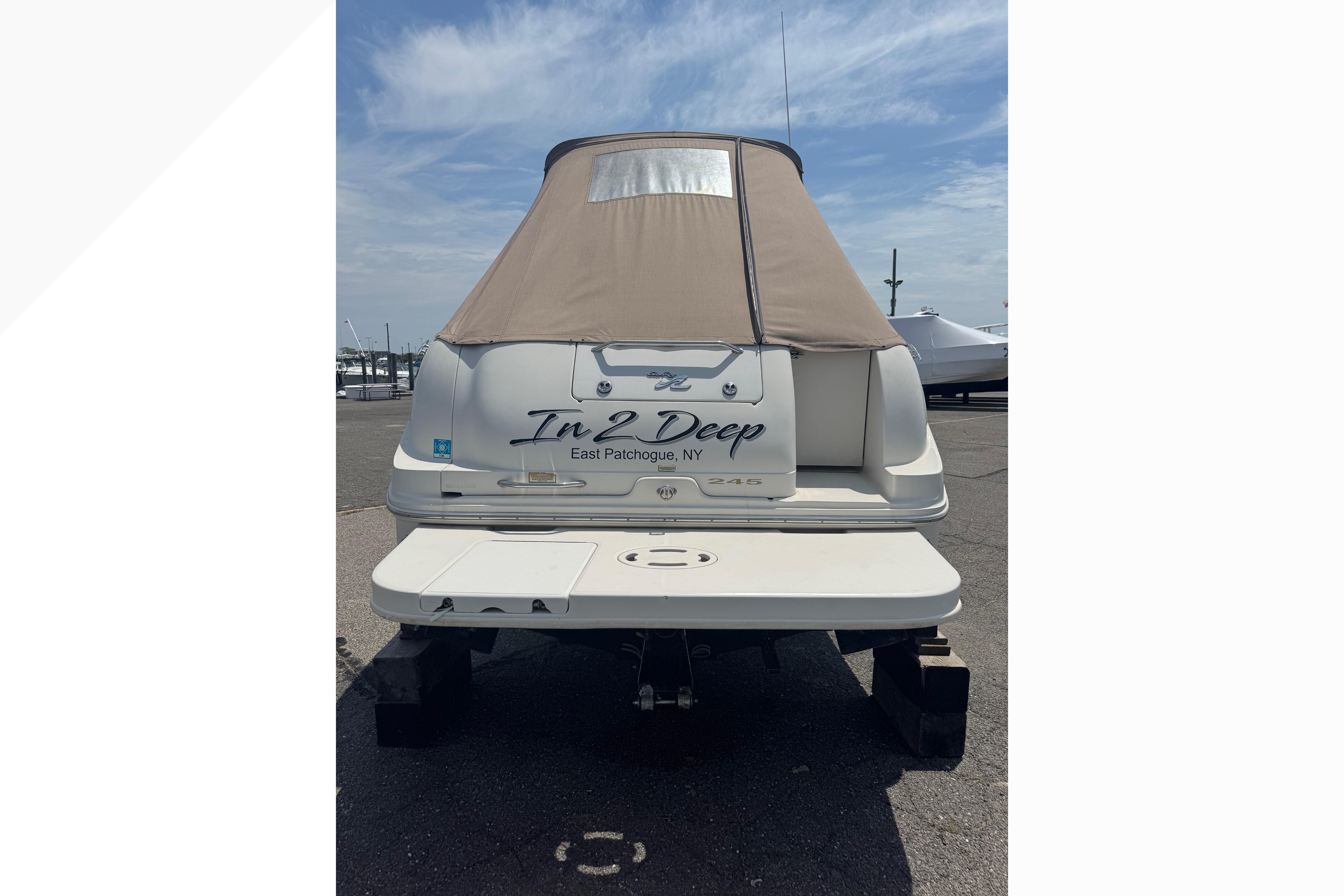2001 Sea Ray 245 Weekender boat with cover, docked at East Patchogue, NY.