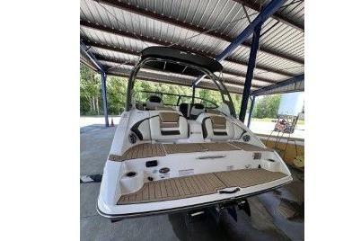 2020 Yamaha Boats 212SE under covered storage area.