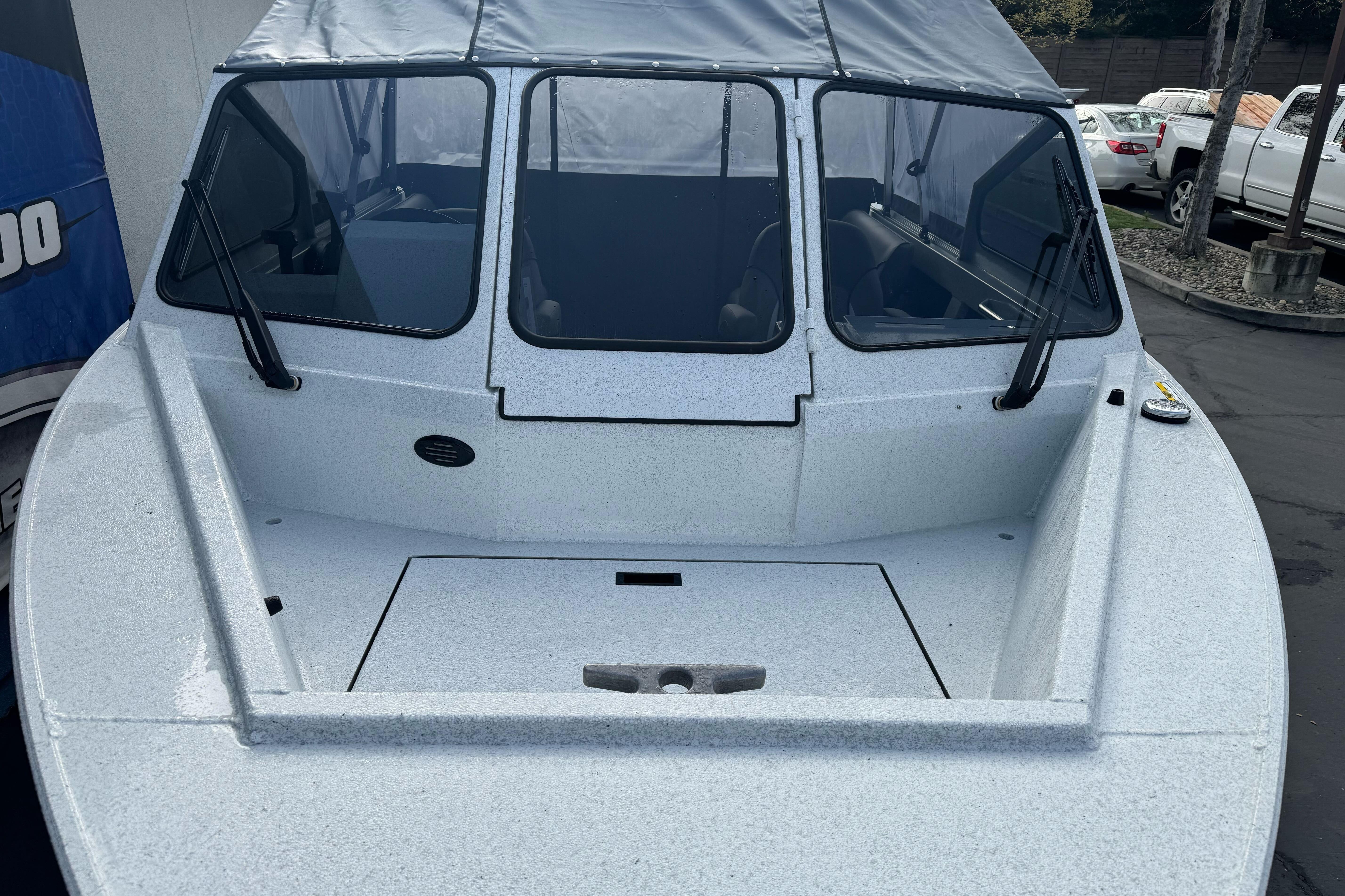 KingFisher 2025 Escape boat, 2026 model, with windshield and covered cabin.