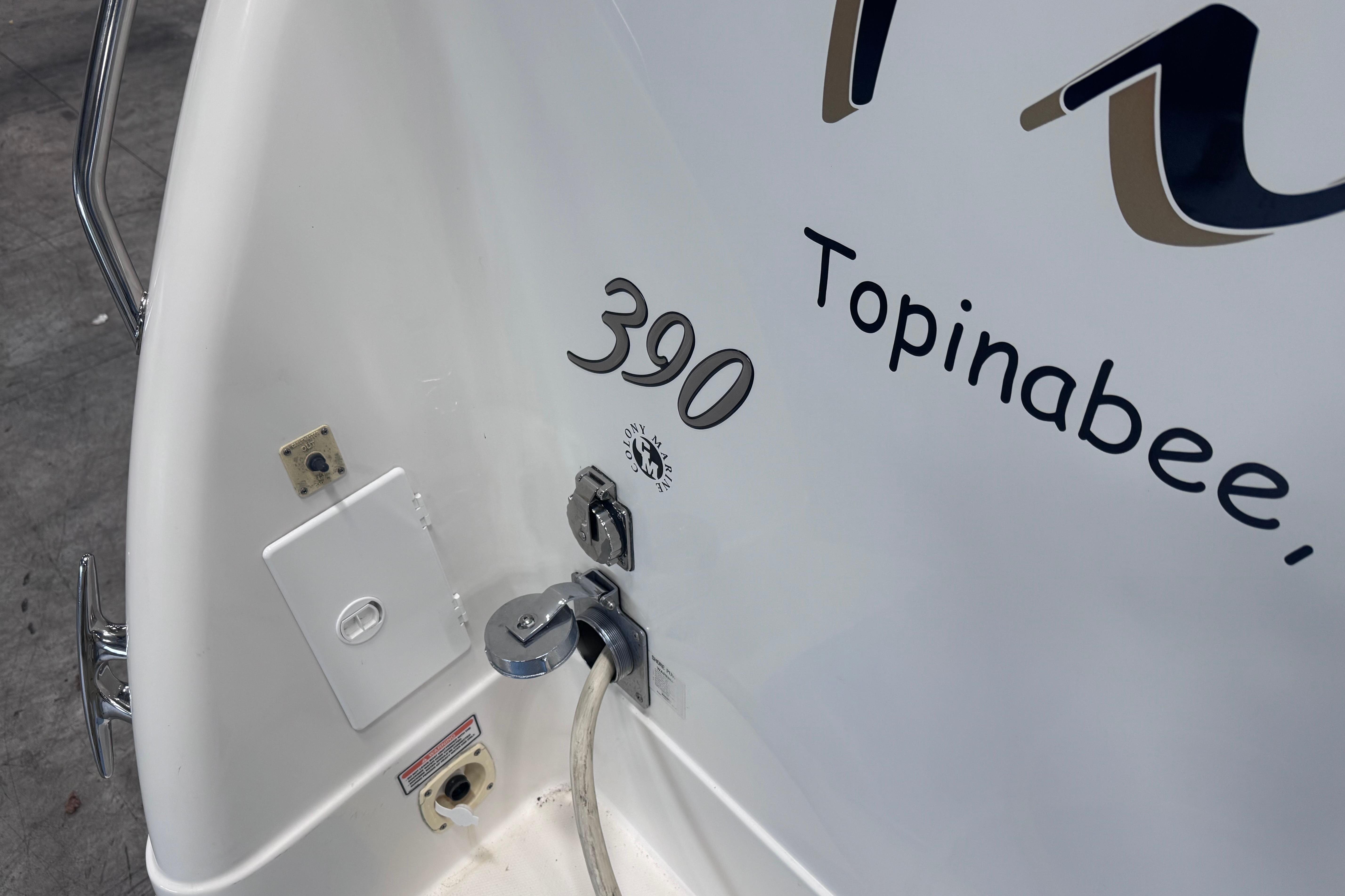 2004 Sea Ray 390 Motor Yacht stern with Topinabee lettering and utility connections.