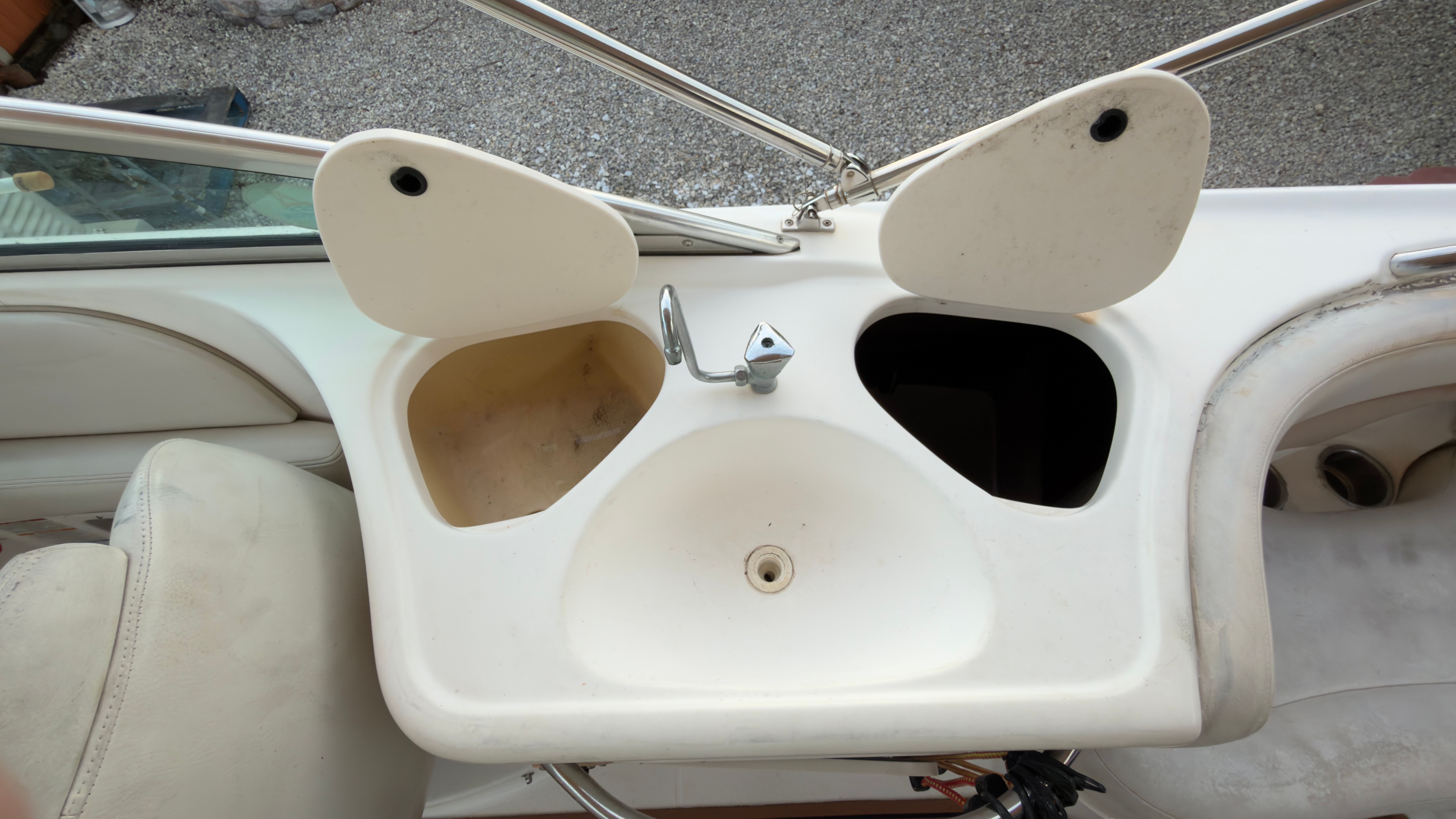 Sink area on a 2003 Chaparral 263 Sunesta Deckboat.