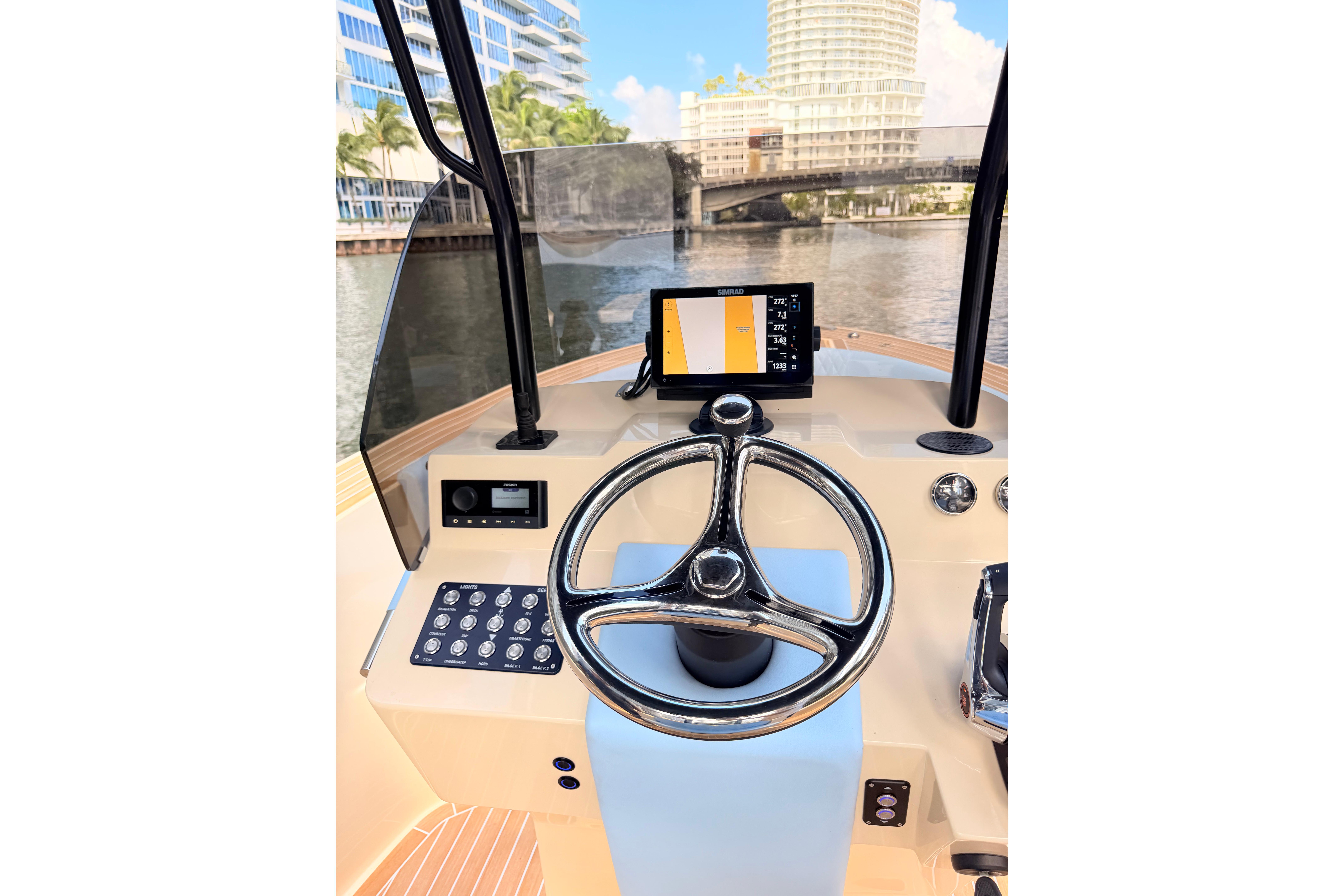 Steering console of 2026 Lilybaeum Levanzo 25 boat with navigation display.