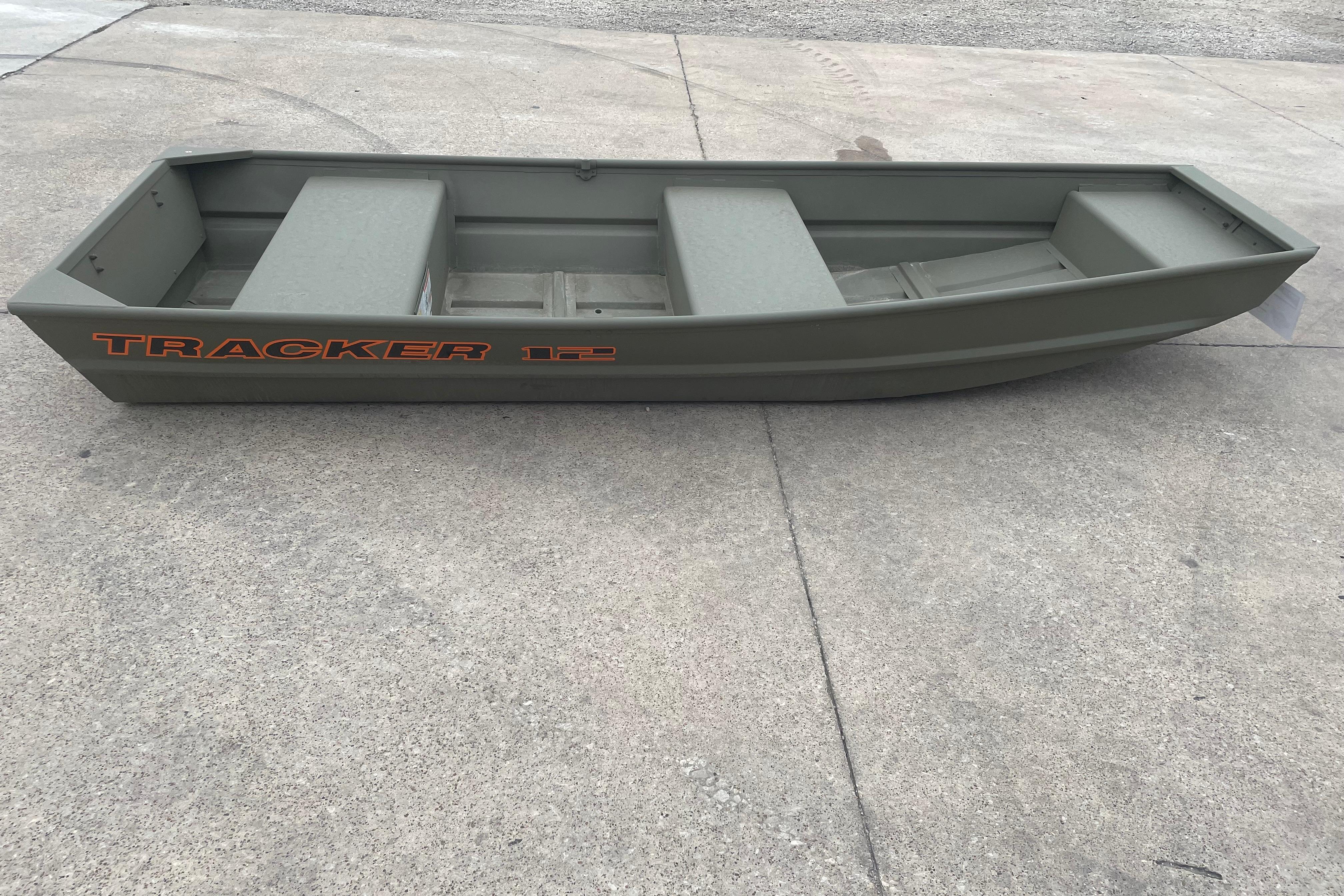 2026 Tracker Grizzly 12 Jon boat on concrete surface, showcasing its sturdy design.