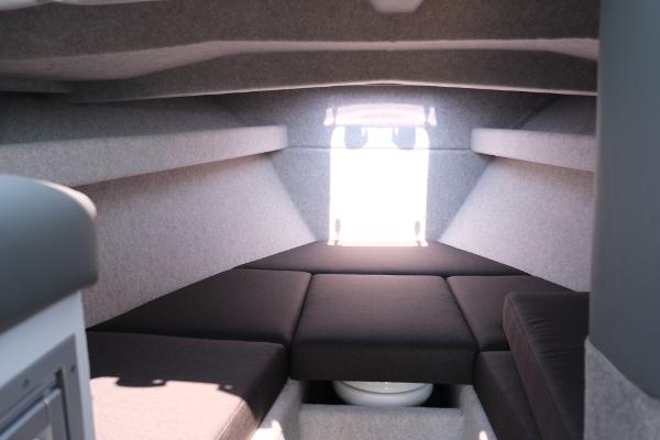 Interior cabin of 2023 Makaira Gen3 800 boat with cushioned seating.