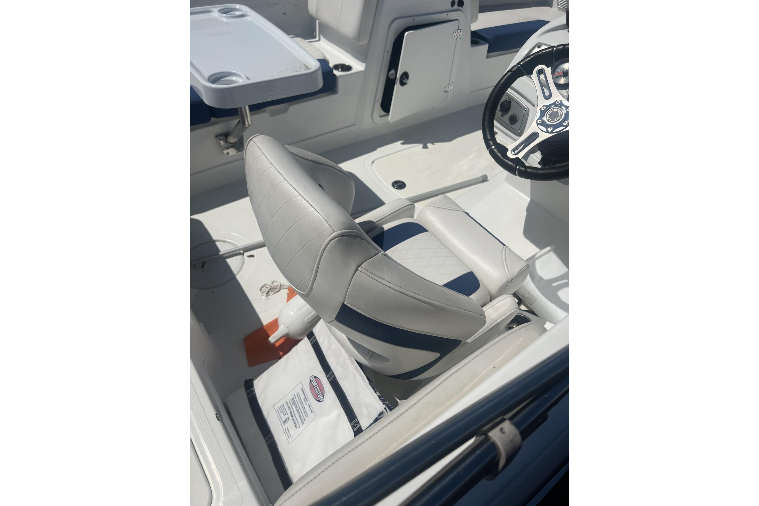 2017 Tahoe 2150 boat interior with steering wheel and cushioned seating.