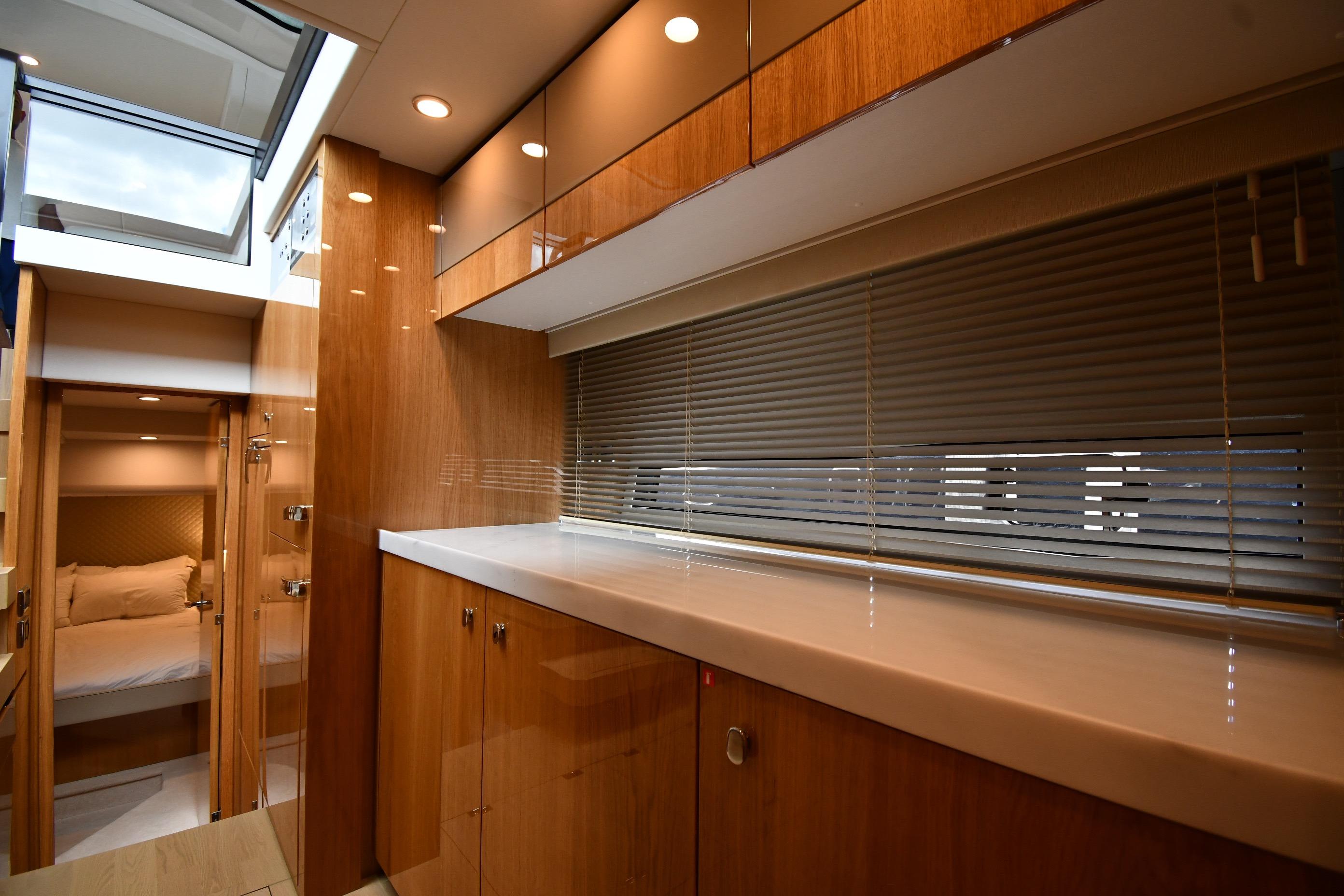 Luxurious interior of 2024 Fairline G50 Targa yacht with wood finishes and modern design.