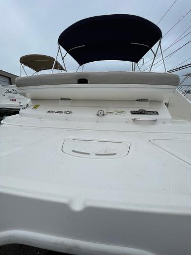 2013 Sea Ray 240 Sundeck boat with canopy, viewed from the rear.
