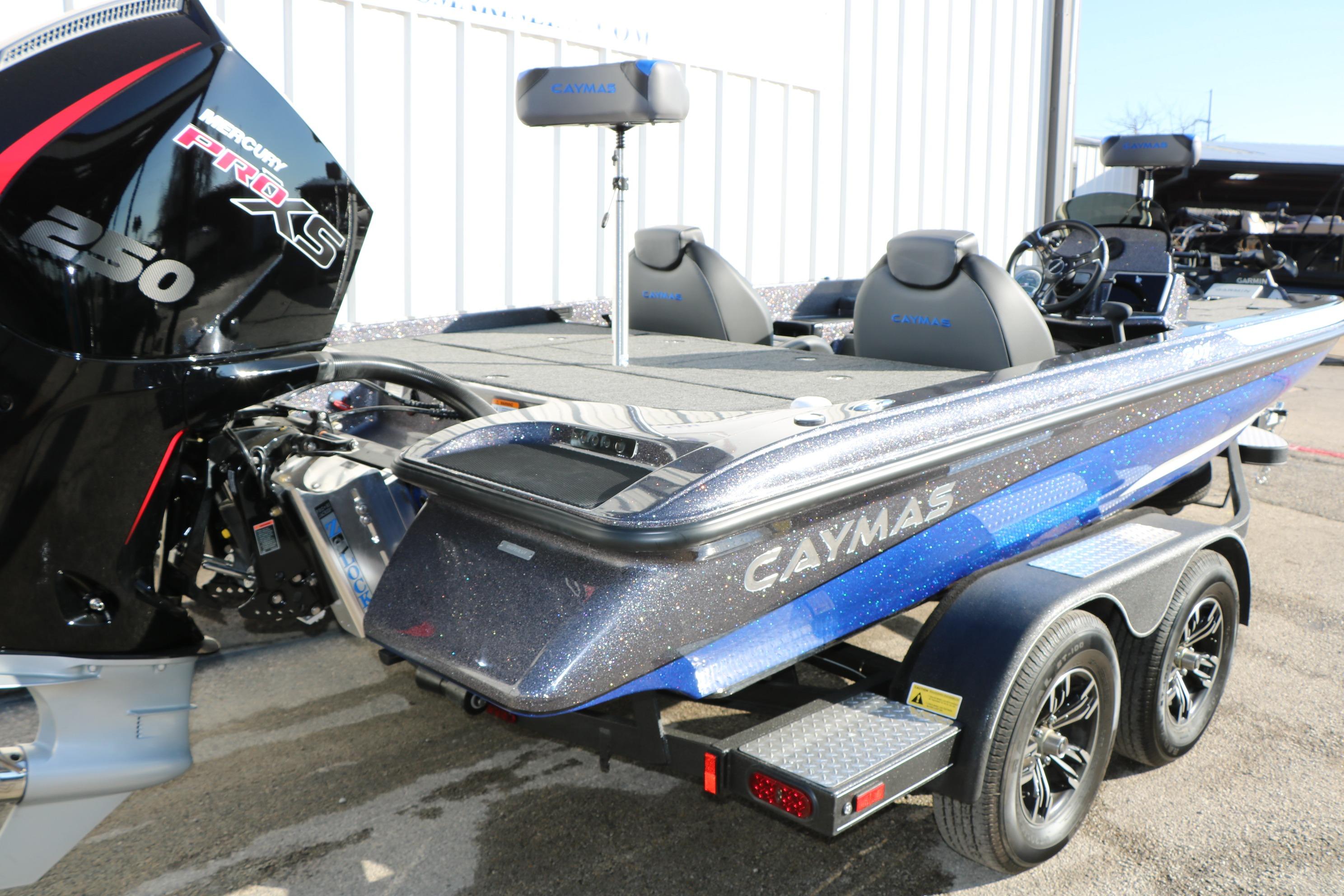 2027 Caymas 201 Pro boat with Mercury 250 Pro XS engine, parked on a trailer.