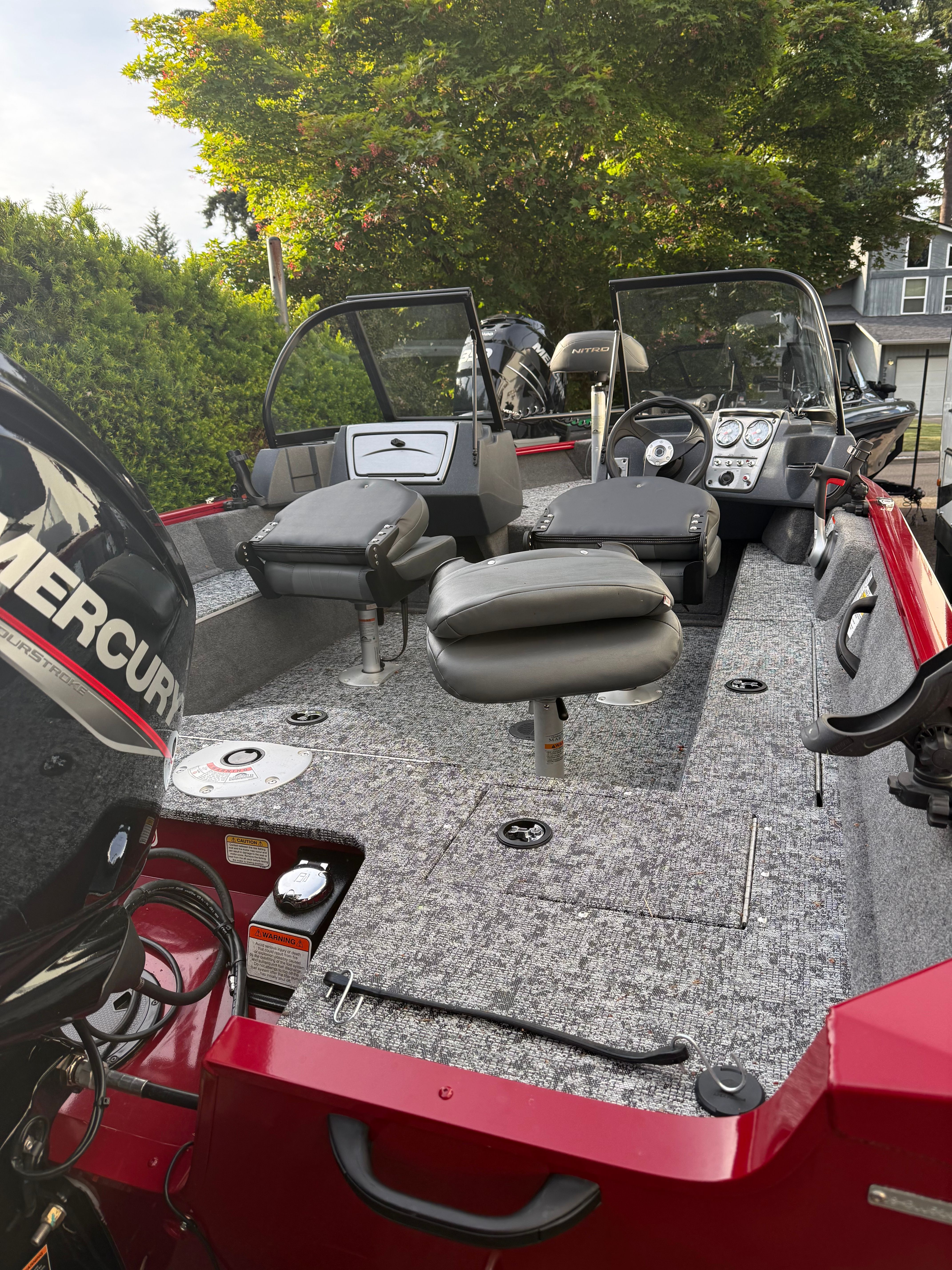 2025 Tracker Pro Guide V-16 WT boat with gray interior.