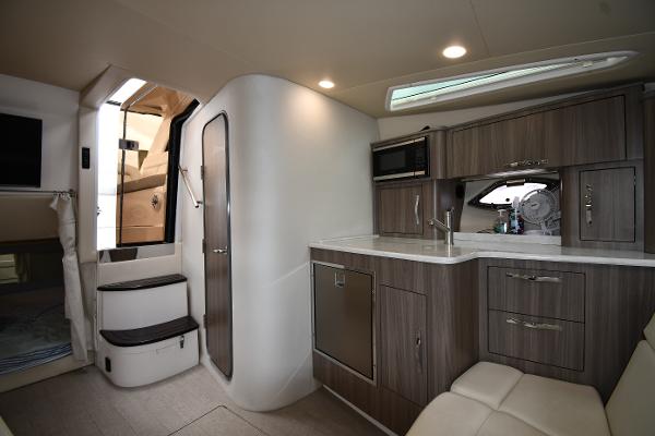 Interior of 2021 Regal 35 Sport Coupe, featuring modern kitchen and seating area.