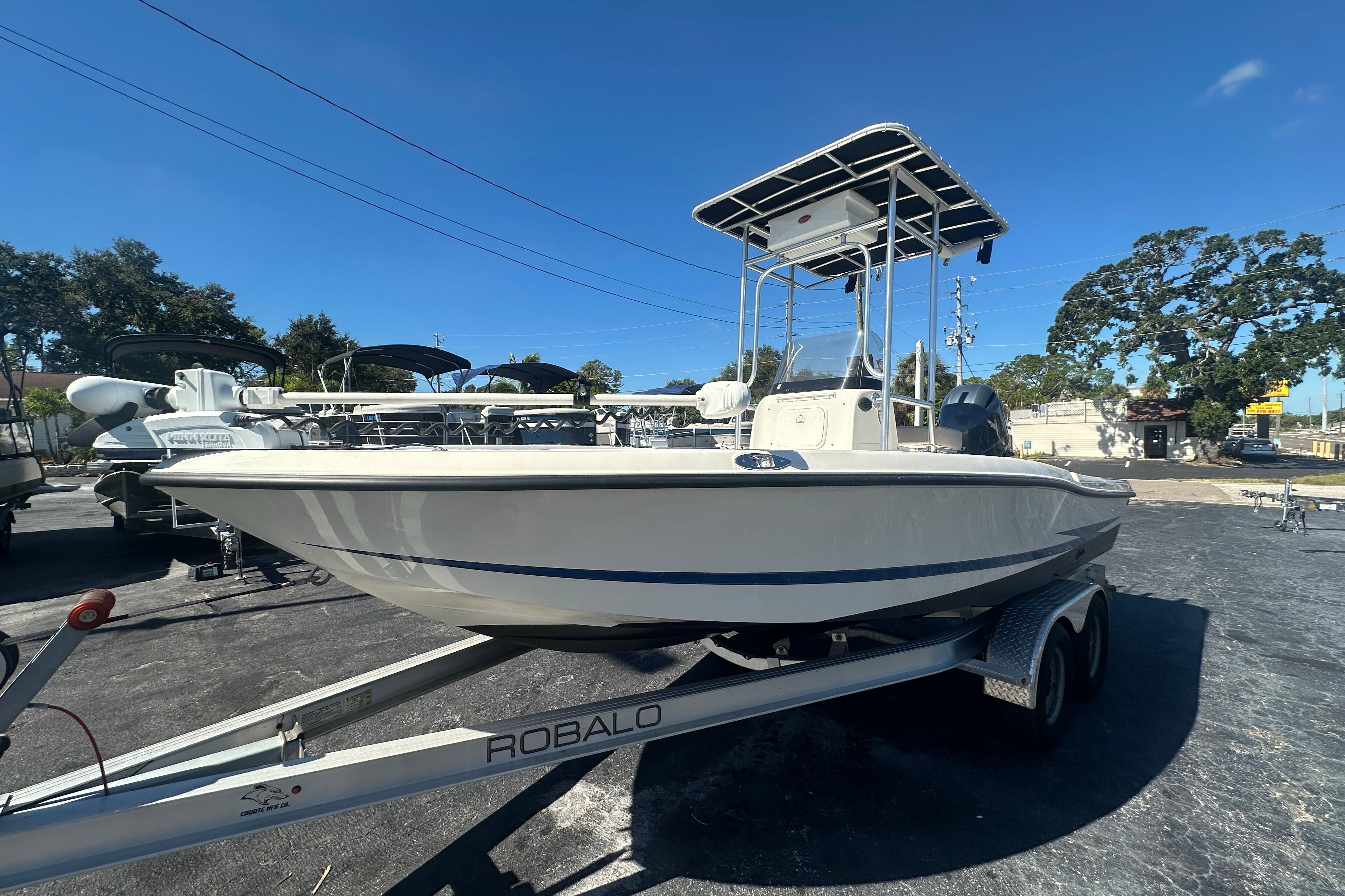 2003 Hydra-Sports 19 Bay Bolt boat on Robalo trailer, parked outdoors.