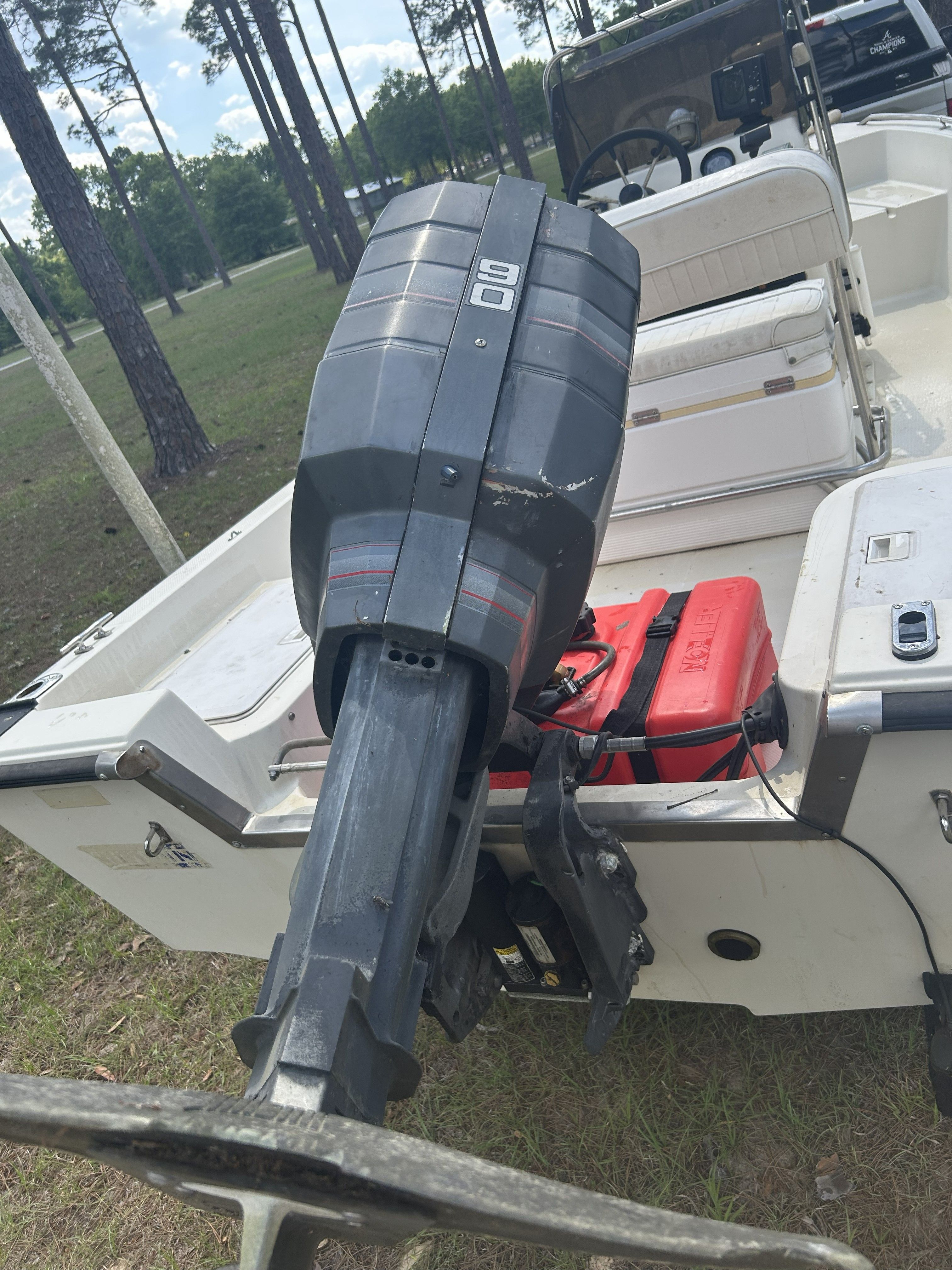 1993 Key West 1720 boat with outboard motor and red fuel tank.