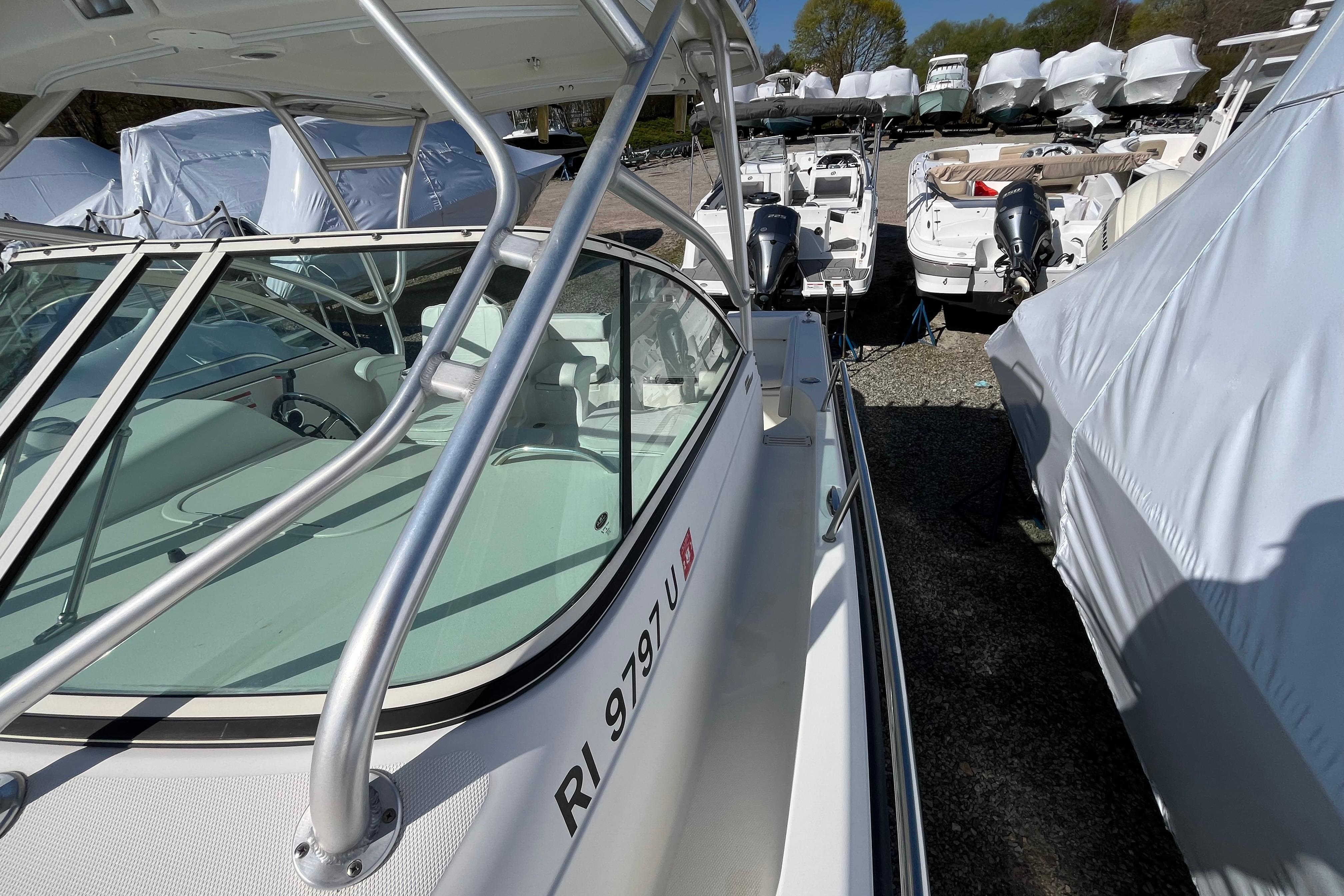 2009 Hydra-Sports 2000 WA boat in storage, surrounded by other covered boats.