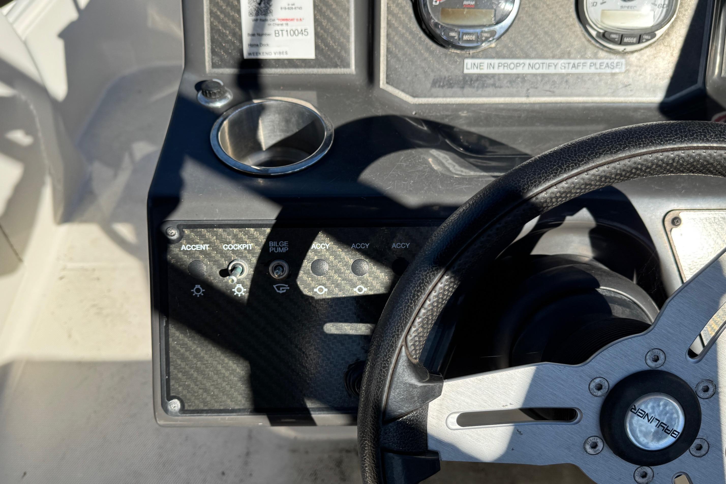 2022 Bayliner VR6 Bowrider OB dashboard with steering wheel and control panel.