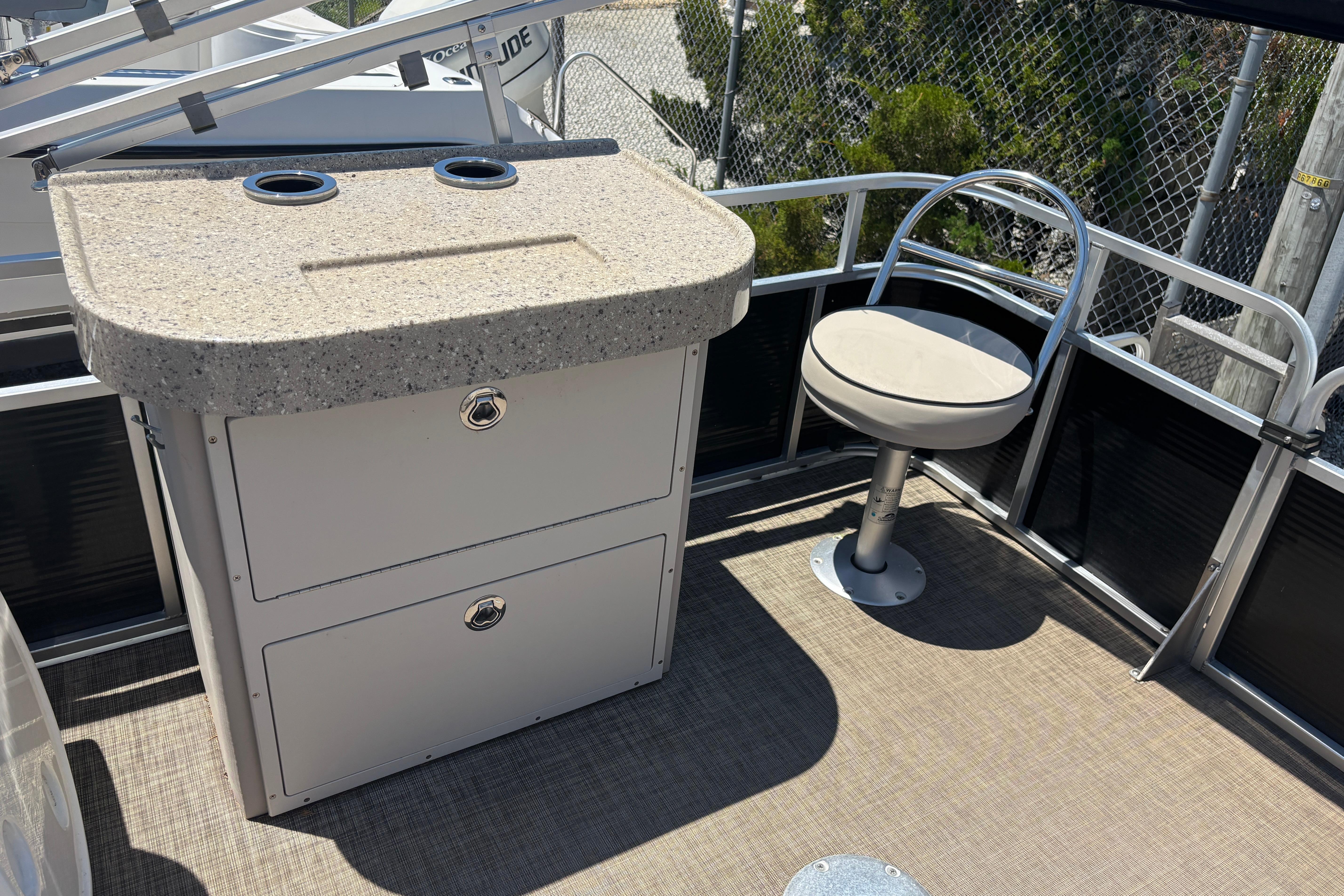 2017 Qwest LS 822 Bar boat interior with bar counter and swivel chair.