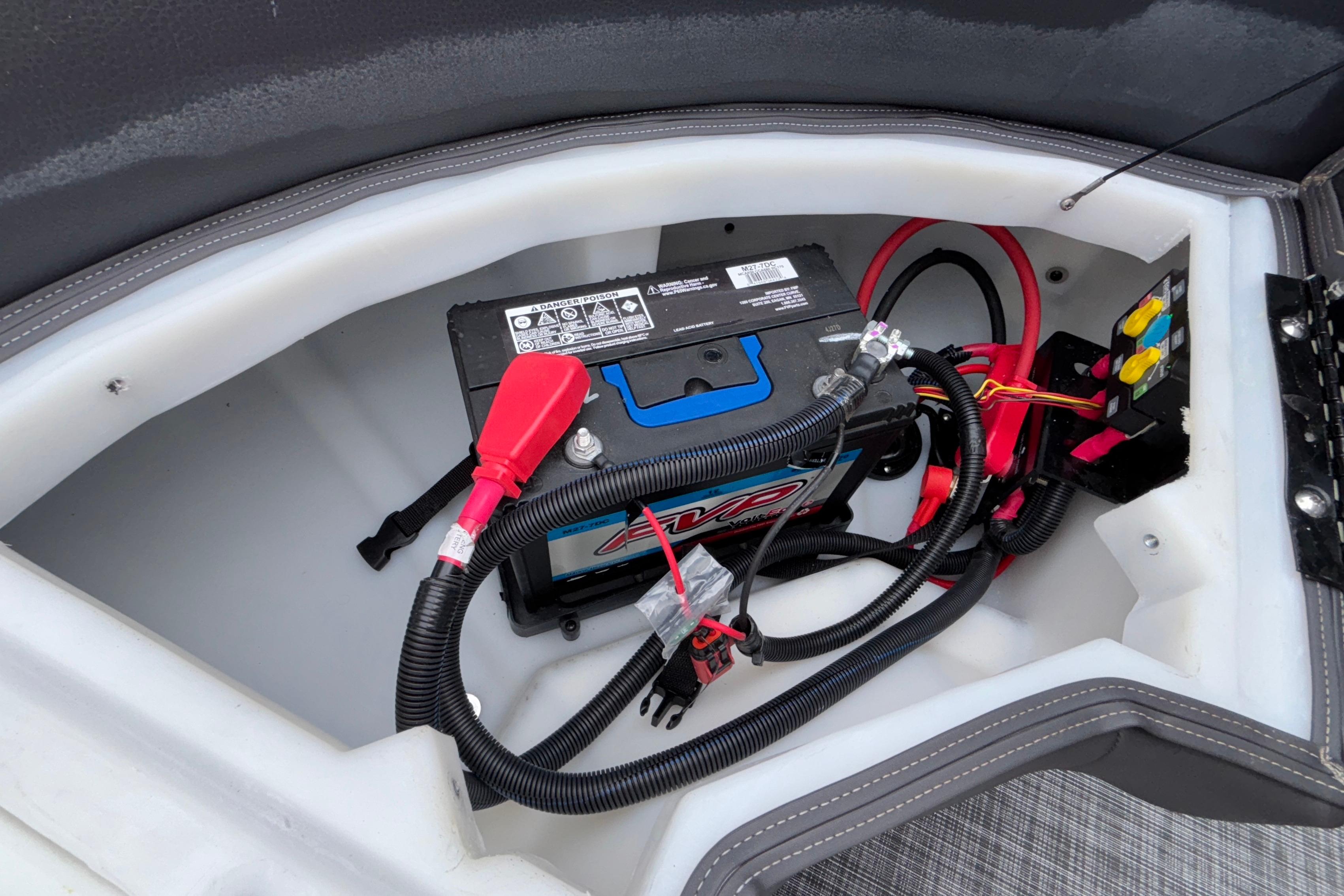 Battery compartment of 2026 Viaggio D28UW A-T with wiring and connectors.