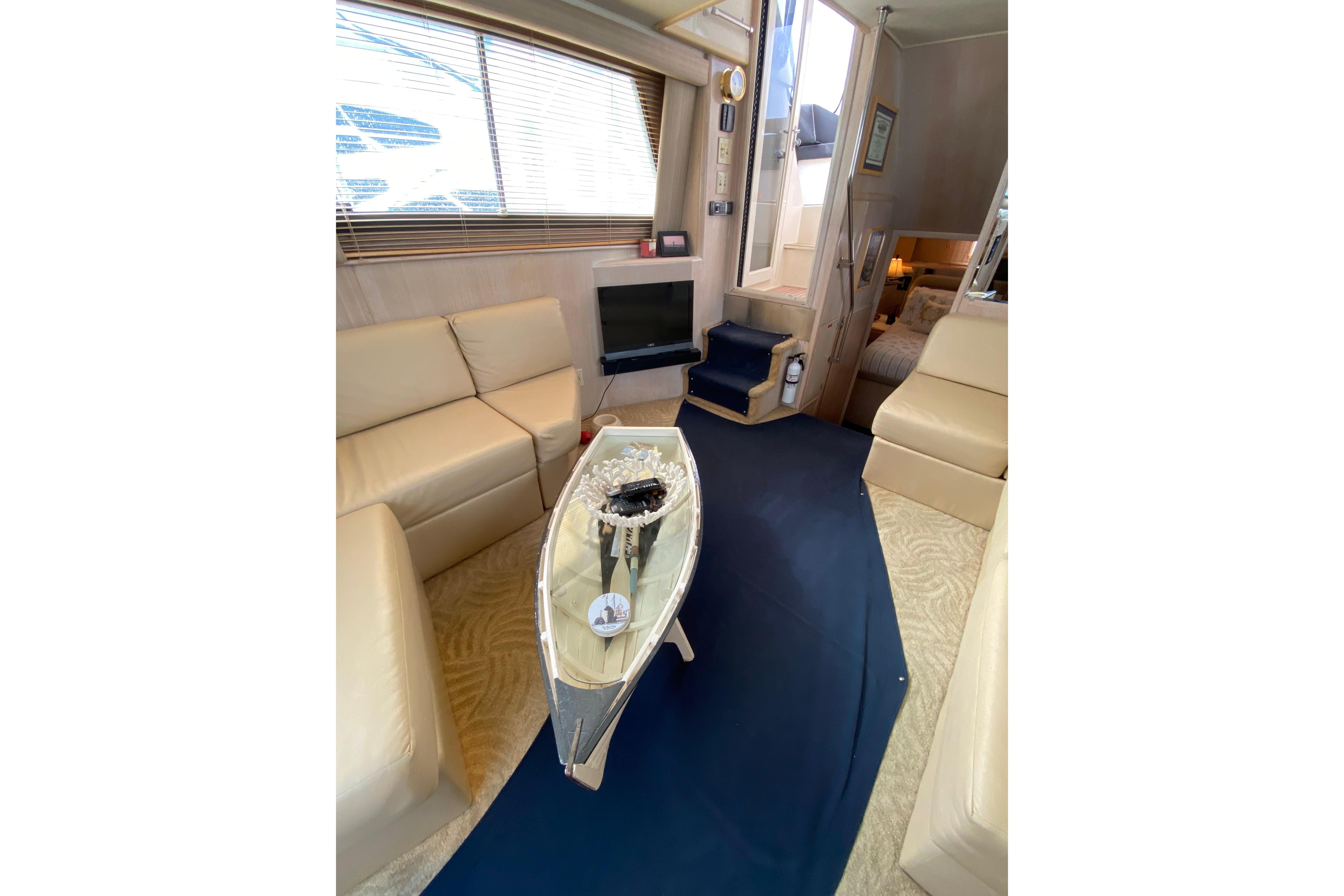 Luxurious interior of 1991 Hatteras 40 Motor Yacht with elegant seating and decor.