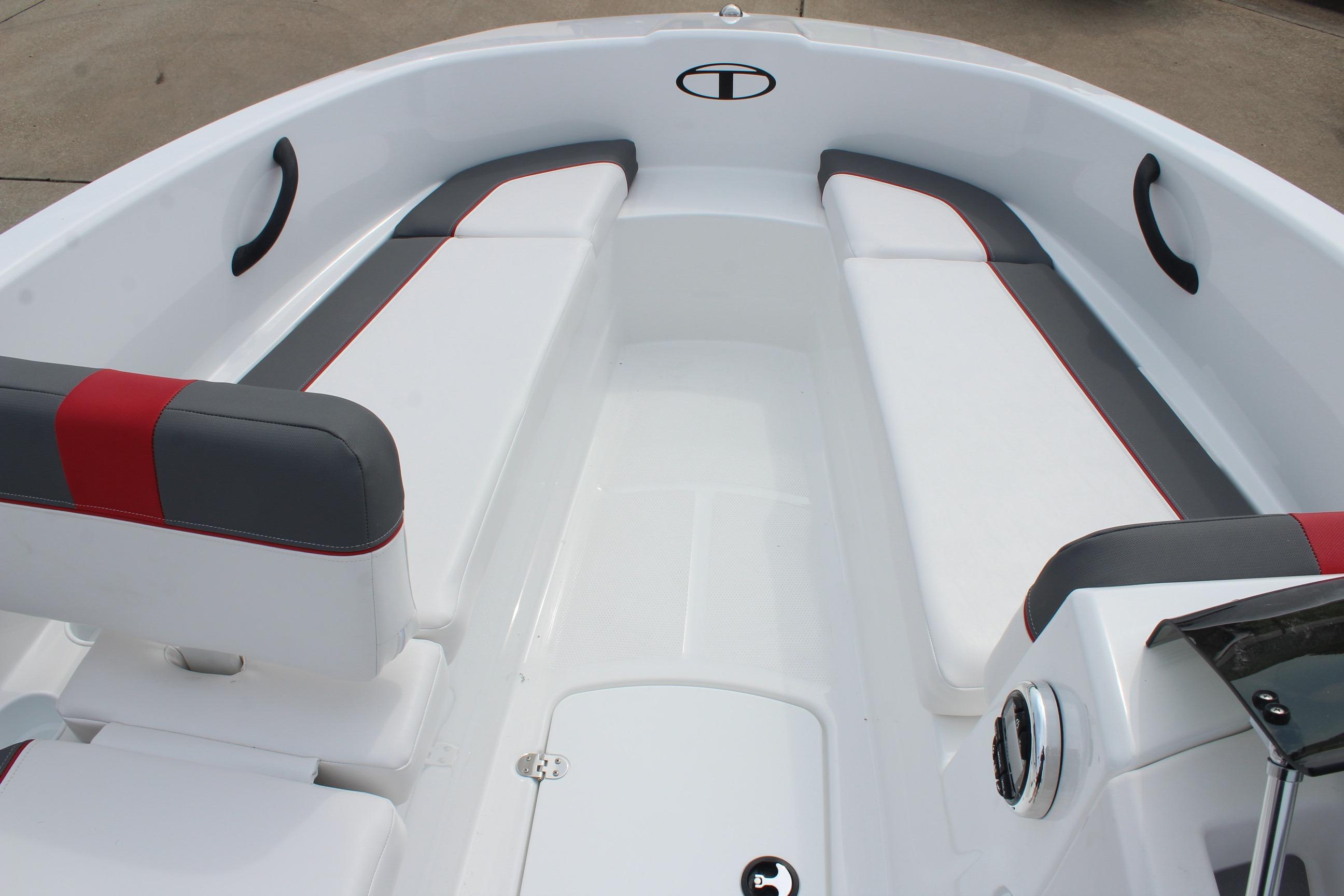 2026 Tahoe T16 boat interior with white, gray, and red seating, showcasing modern design.