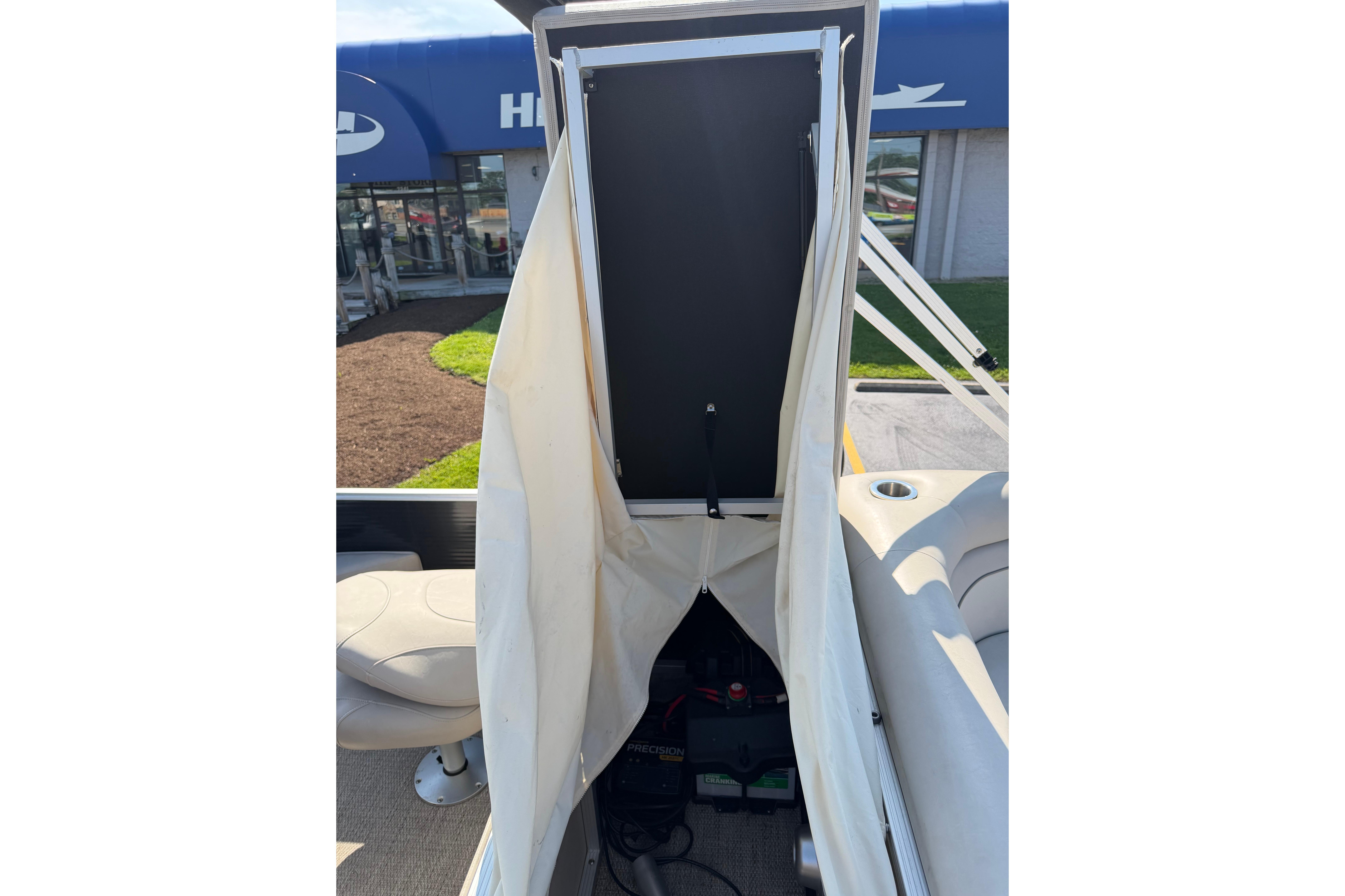 2018 Bennington 21 SF boat interior with open storage compartment.
