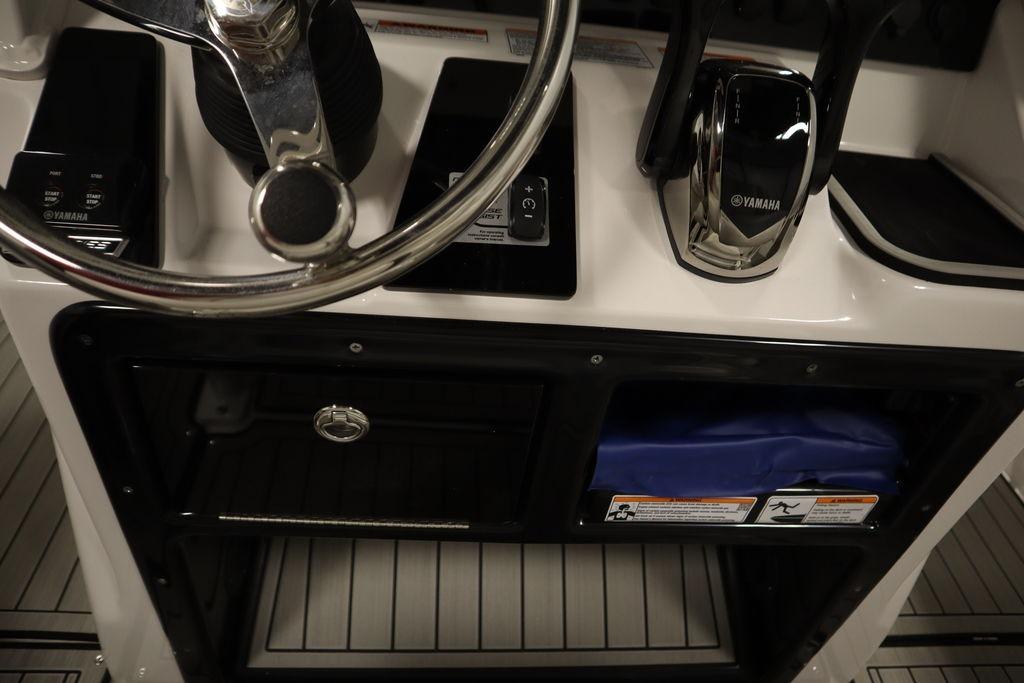 2026 Yamaha Boats 255 FSH Sport E dashboard with steering wheel and controls.