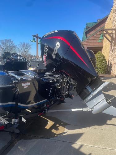 2025 Nitro ZV19 boat with powerful outboard motor, parked outdoors.