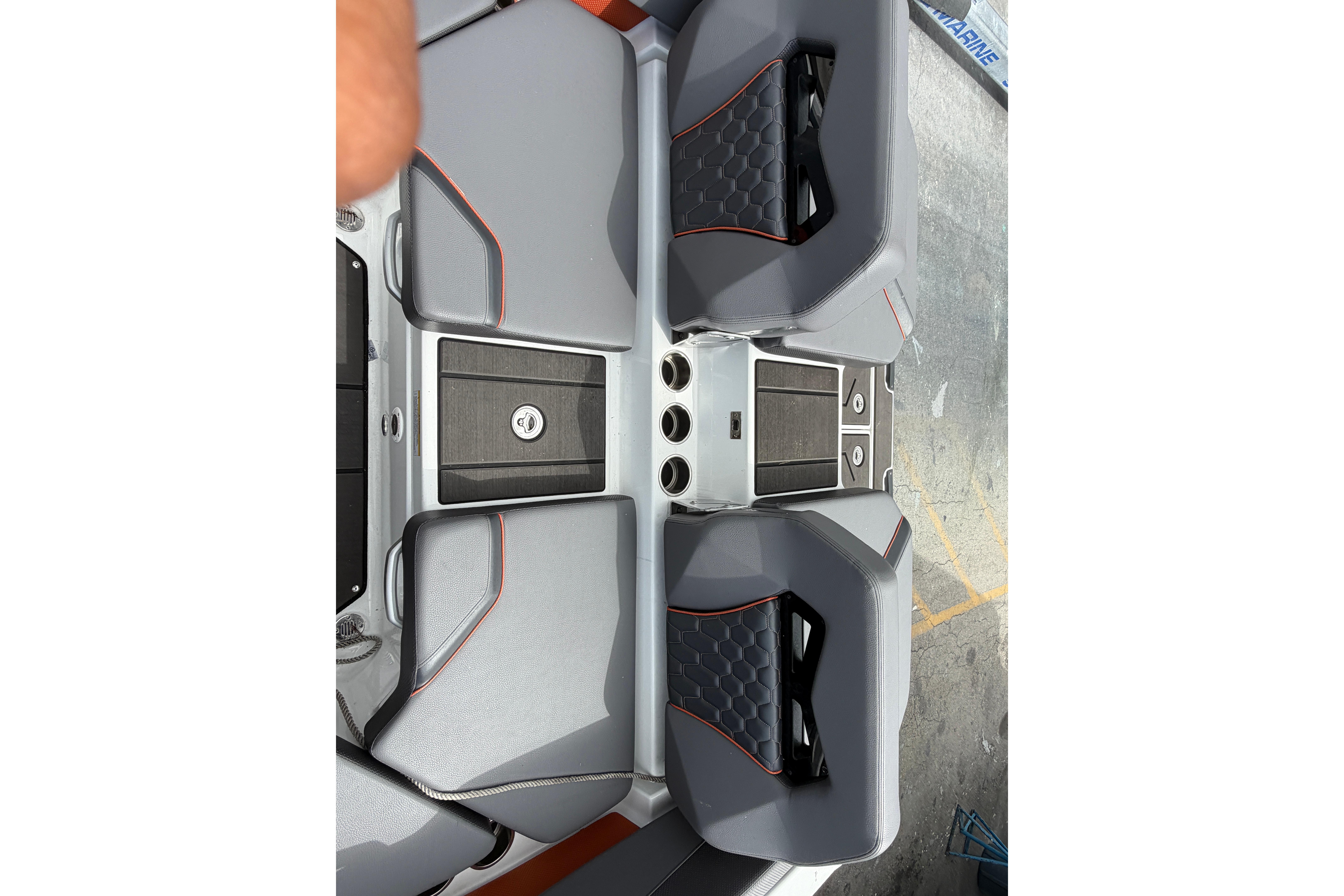 Interior seating of 2026 Scarab 235 LX boat with modern design and gray upholstery.
