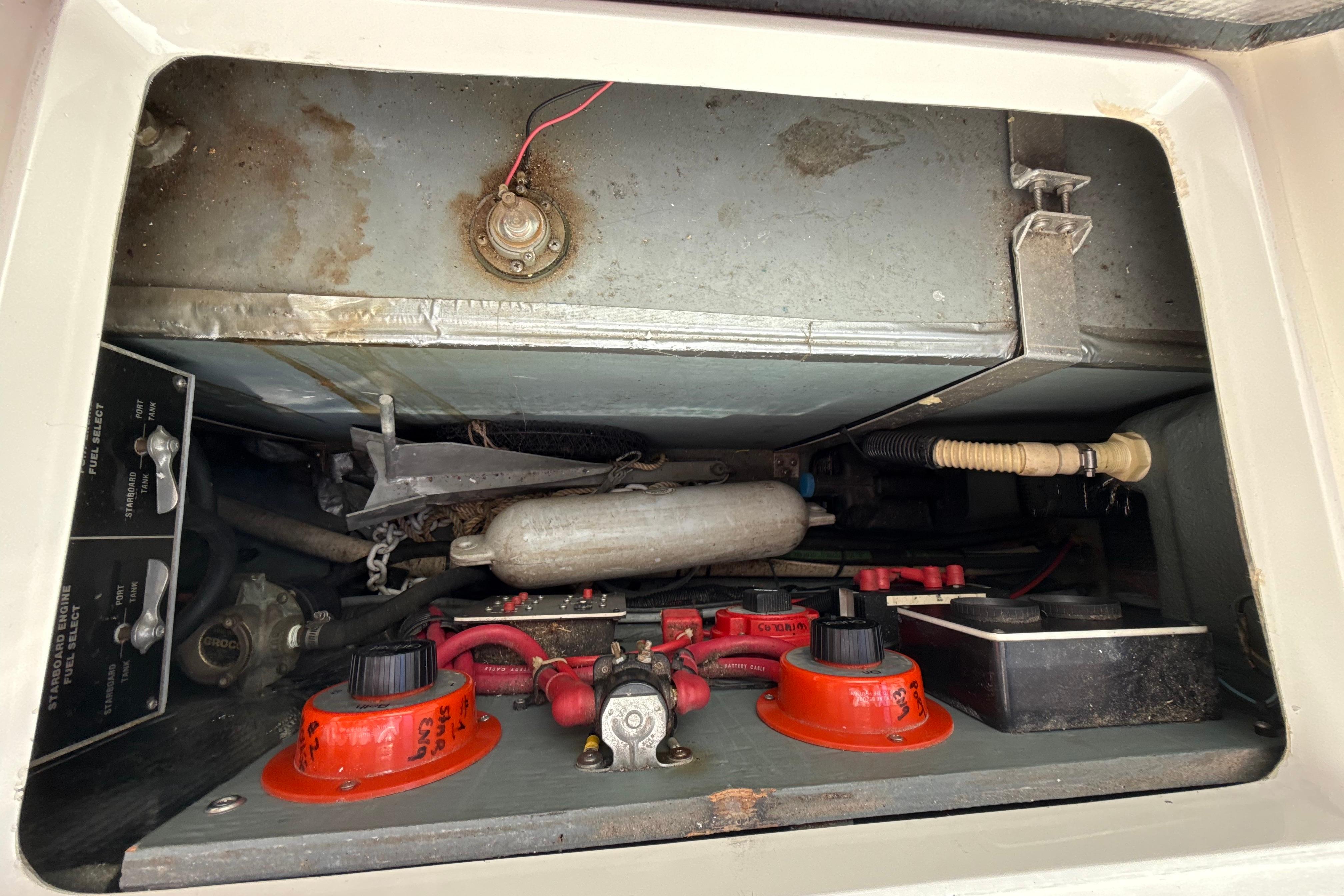 Engine compartment of a 1990 Sea Ray 310 Express Cruiser, showing wiring and components.