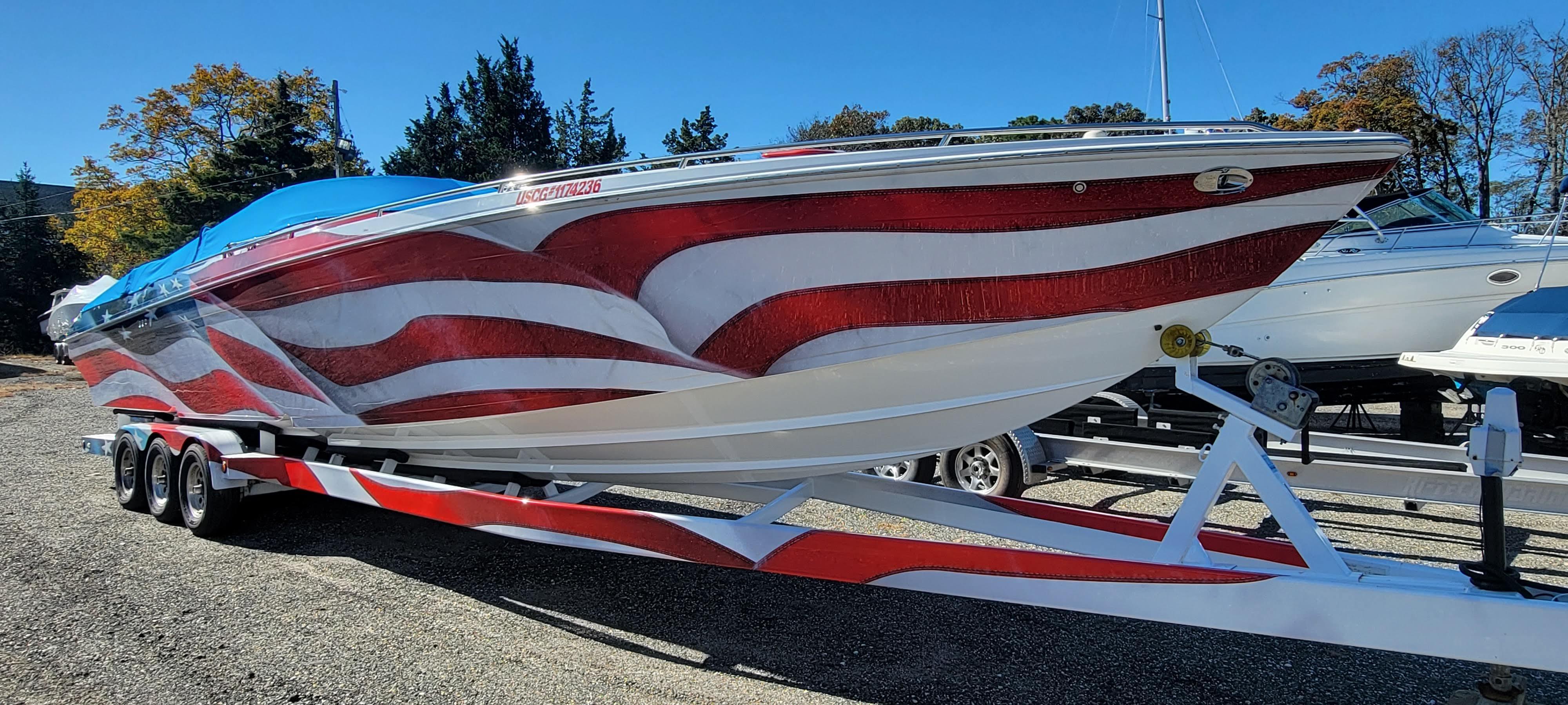 2004 Formula 382 FASTech boat with American flag design on trailer.