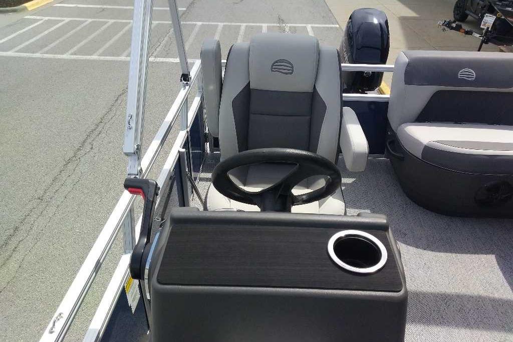 2026 Sun Tracker Bass Buggy 16 XL Select pontoon boat interior with steering wheel and seating.