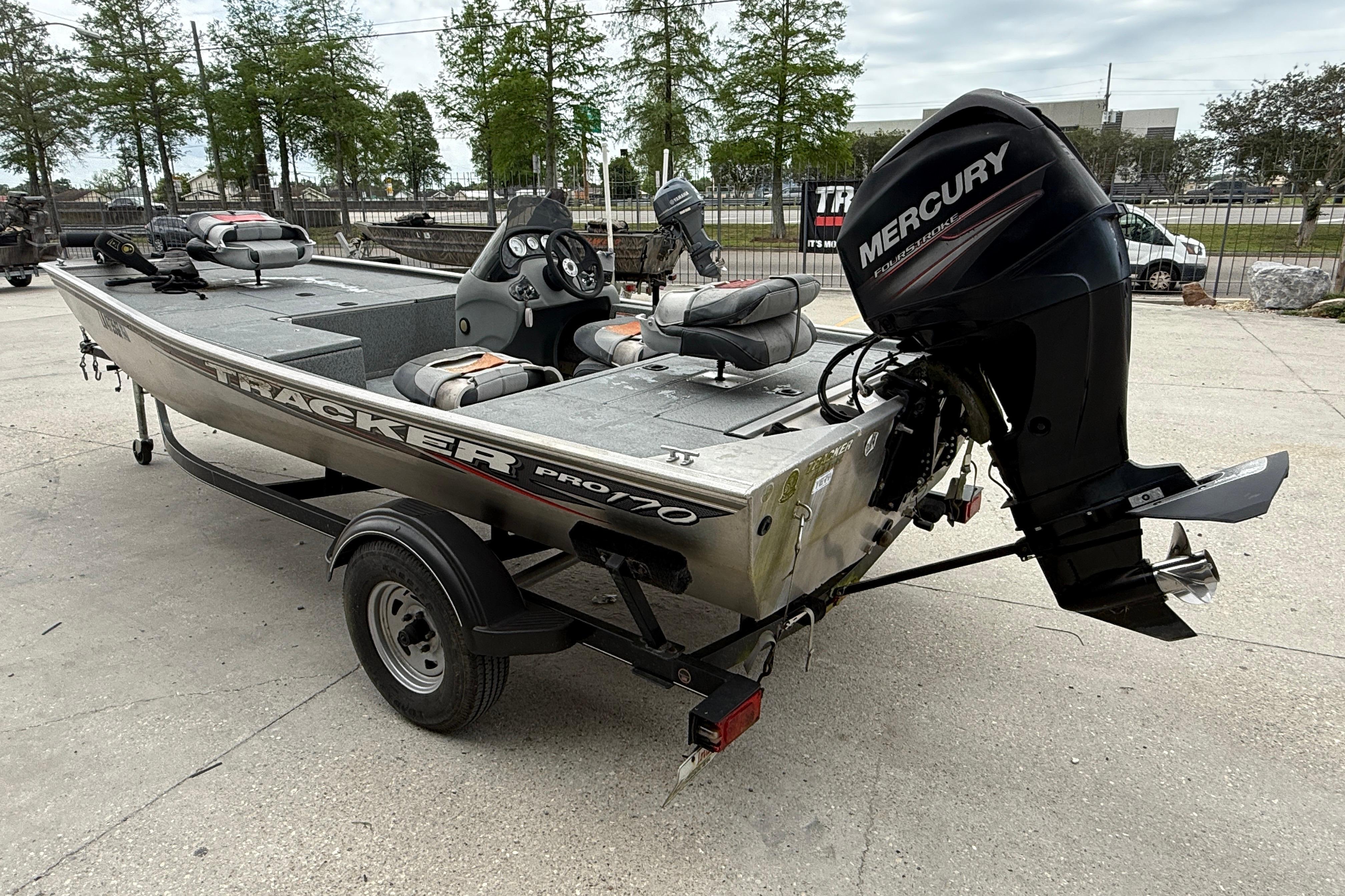 2016 Tracker Pro 170 boat with Mercury outboard motor, parked on a trailer.